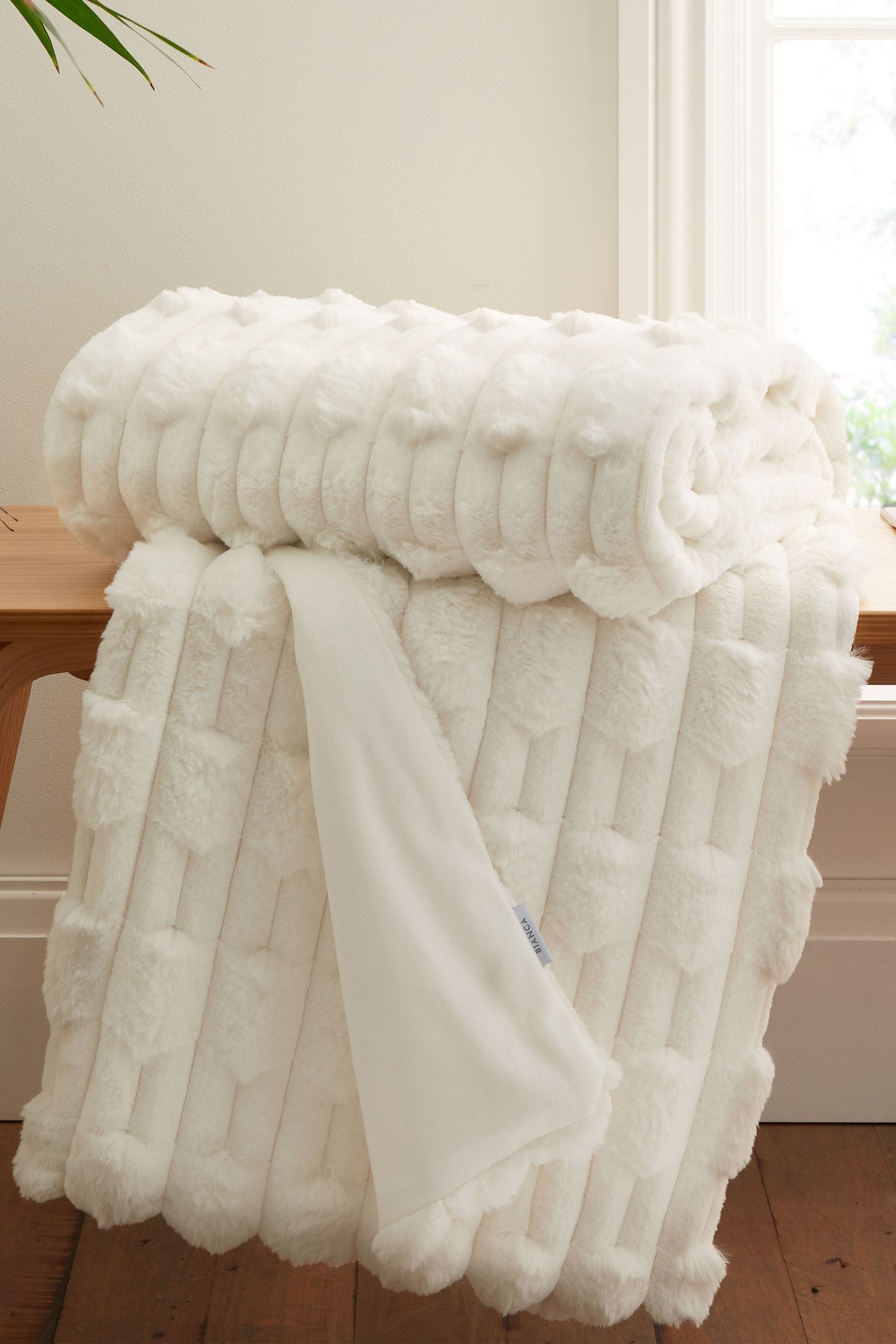 Buy Cream Soft and Cosy Carved Faux Fur Throw from the Next UK