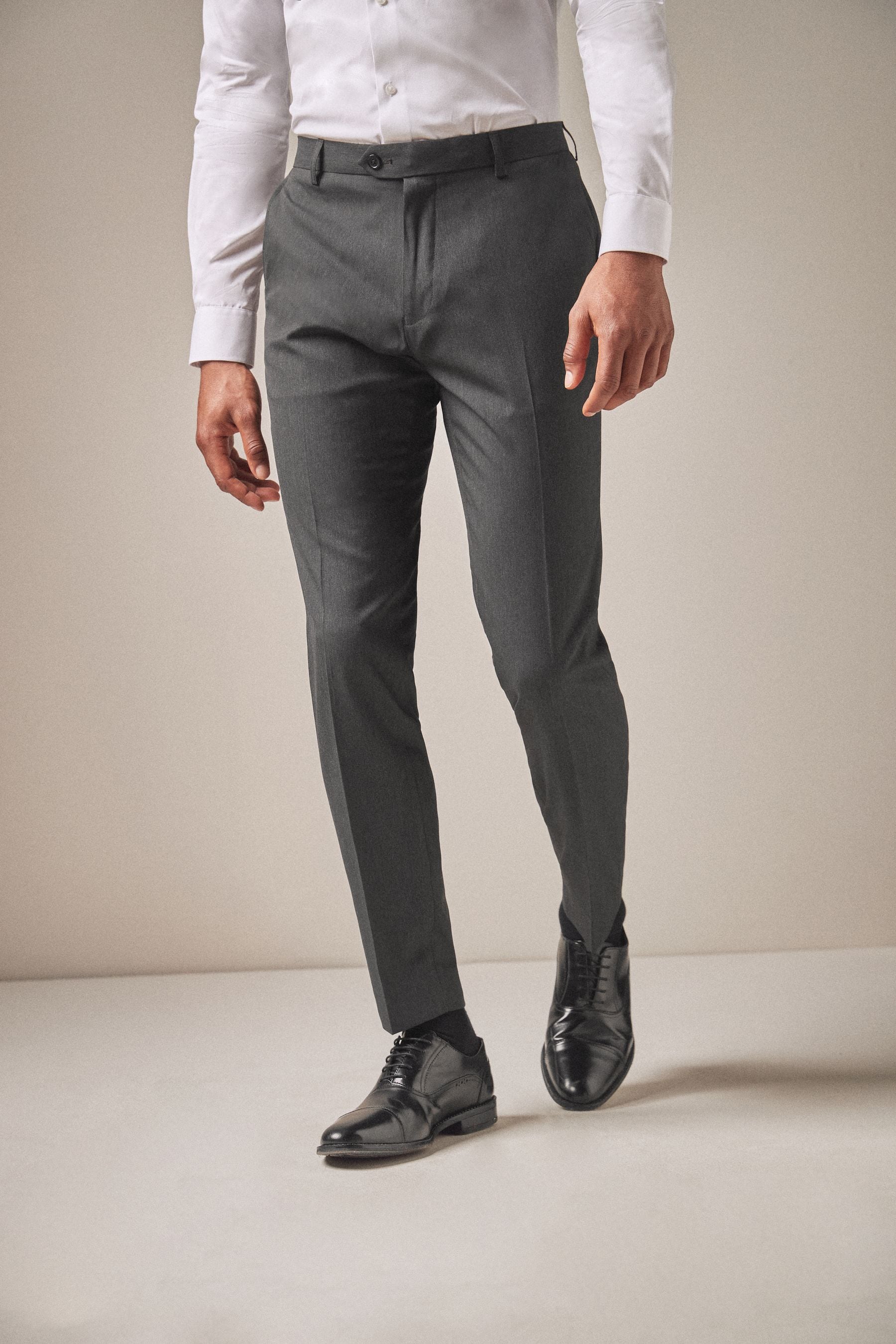 Buy Charcoal Grey Skinny Fit Stretch Smart Trousers from the Next UK online shop