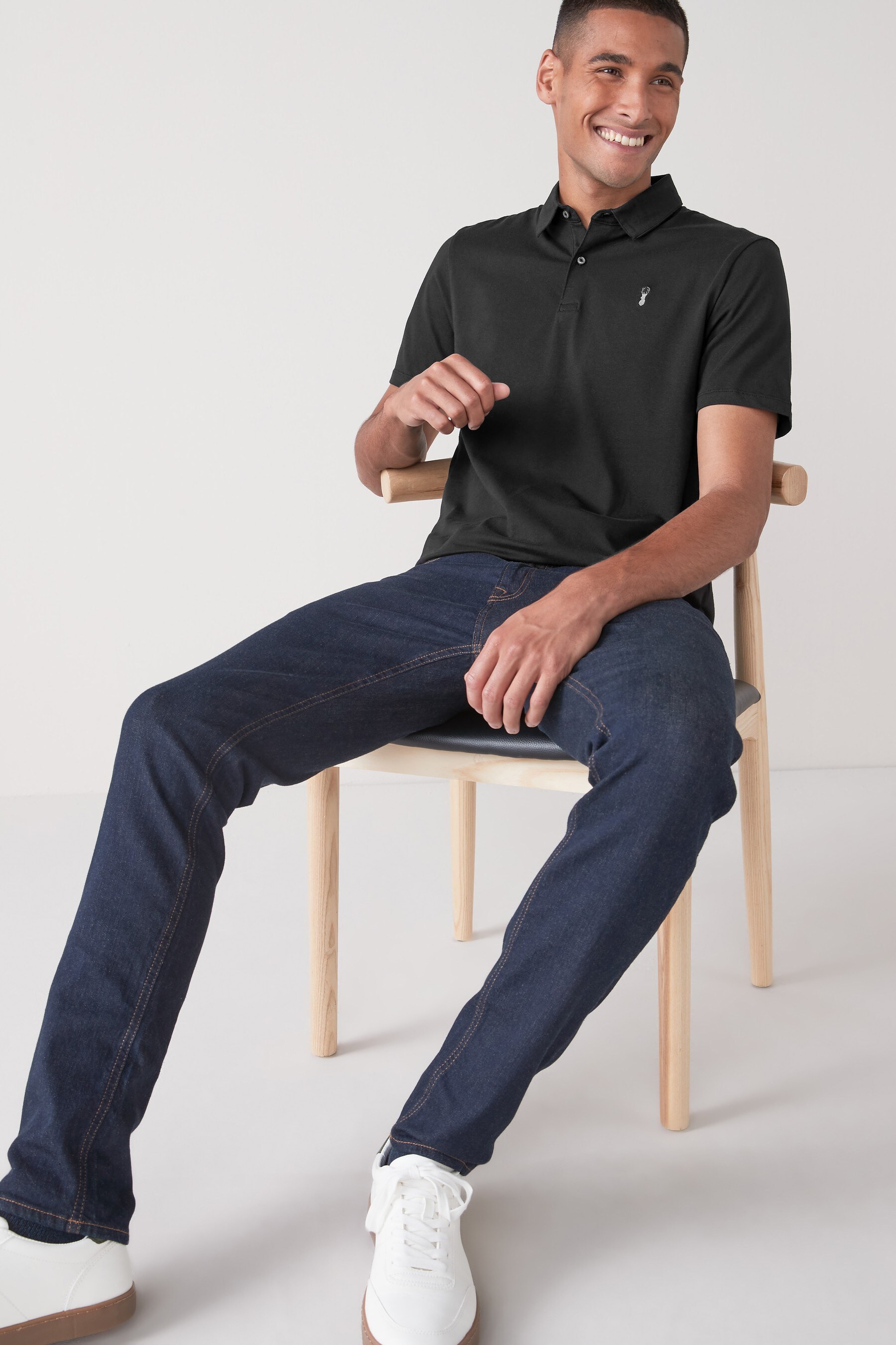 Black polo shirt blue jeans 2025