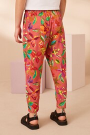 Rust Orange/ Pink Tropical Flower Print Jersey Stretch Lightweight Trousers (3-16yrs) - Image 4 of 8