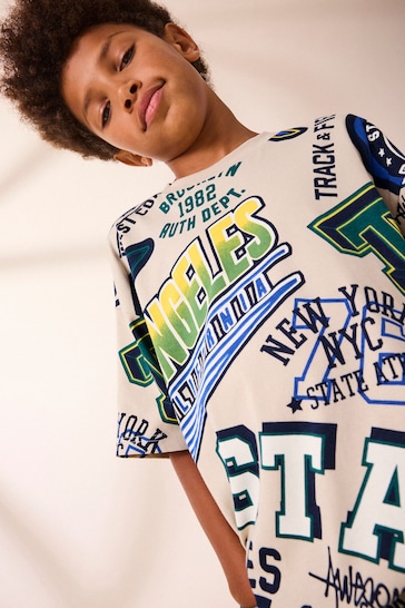 Stone All Over Print Relaxed Fit 100% Cotton Short Sleeve Varsity T-Shirt (3-16yrs)