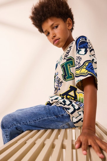 Stone All Over Print Relaxed Fit 100% Cotton Short Sleeve Varsity T-Shirt (3-16yrs)