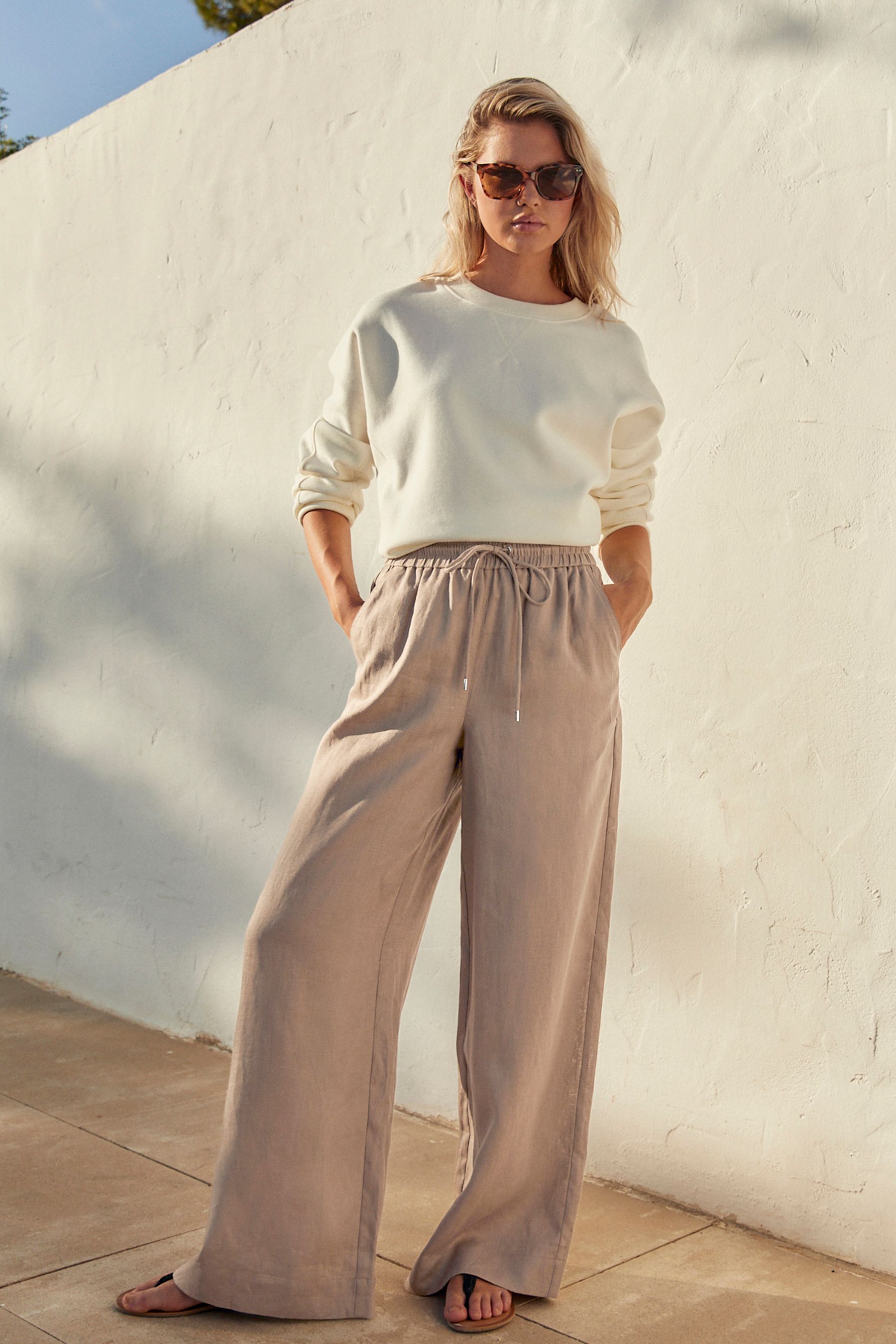Buy Taupe Brown Premium 100 Linen Wide Leg Trousers from Next Bahrain