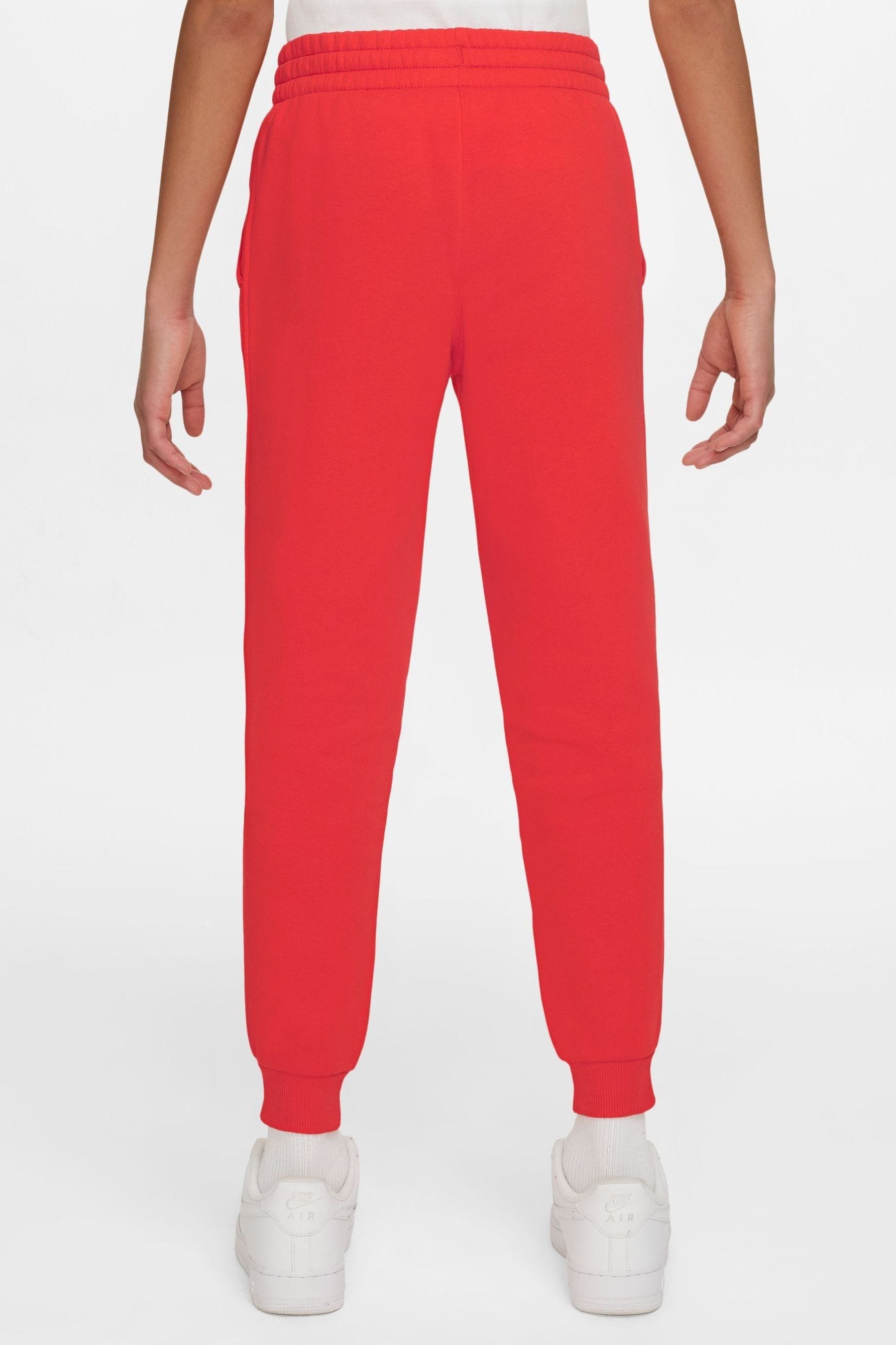 Nike jogger red top
