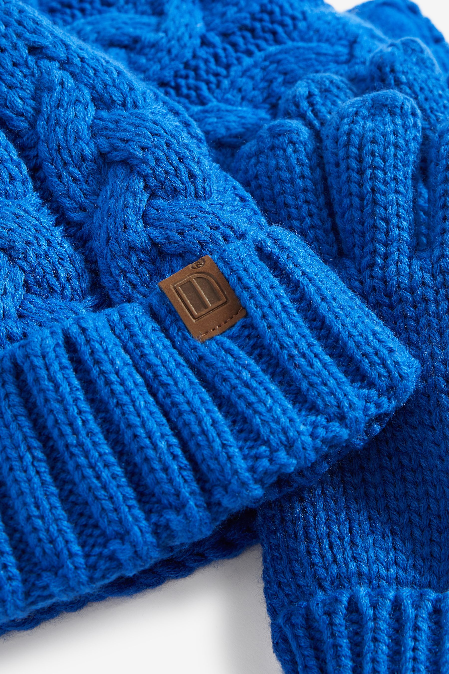 Blue hat and gloves top