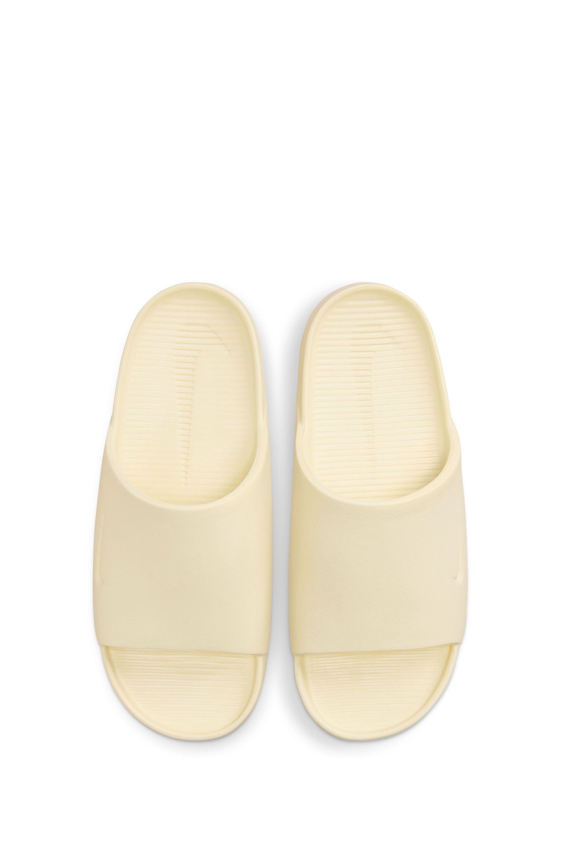 Buy Nike Yellow Calm Sliders from Next Luxembourg