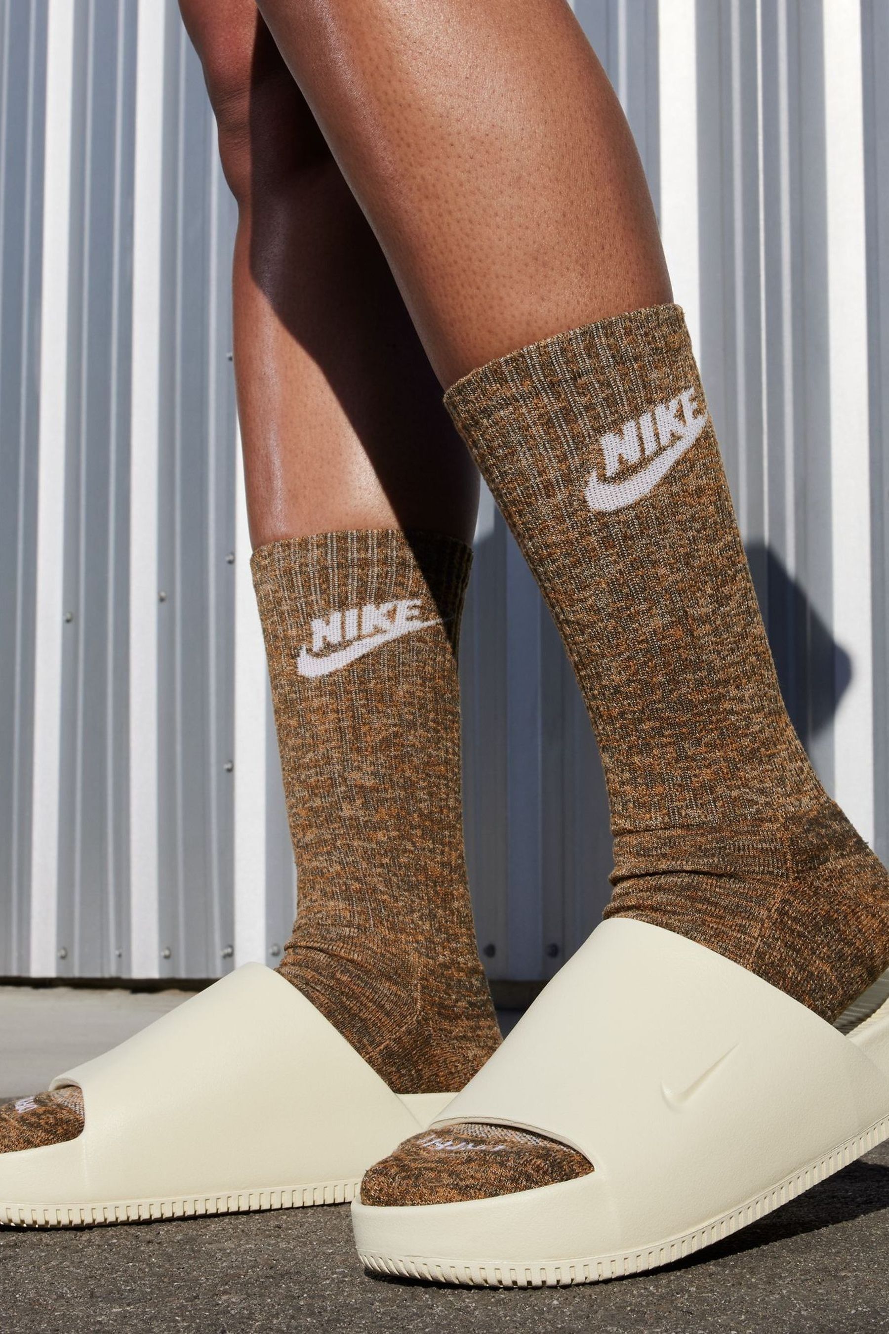 Buy Nike Yellow Calm Sliders from Next Luxembourg