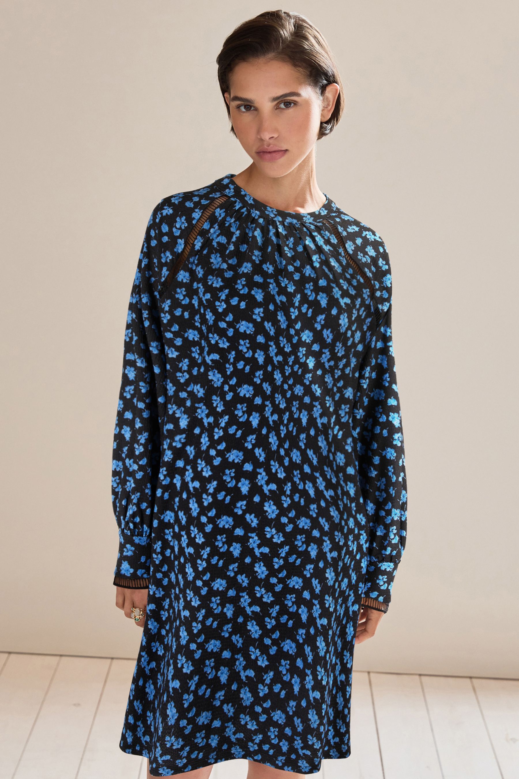 Buy Black Ditsy Floral Long Sleeve Ladder Detail Mini Dress from Next Luxembourg