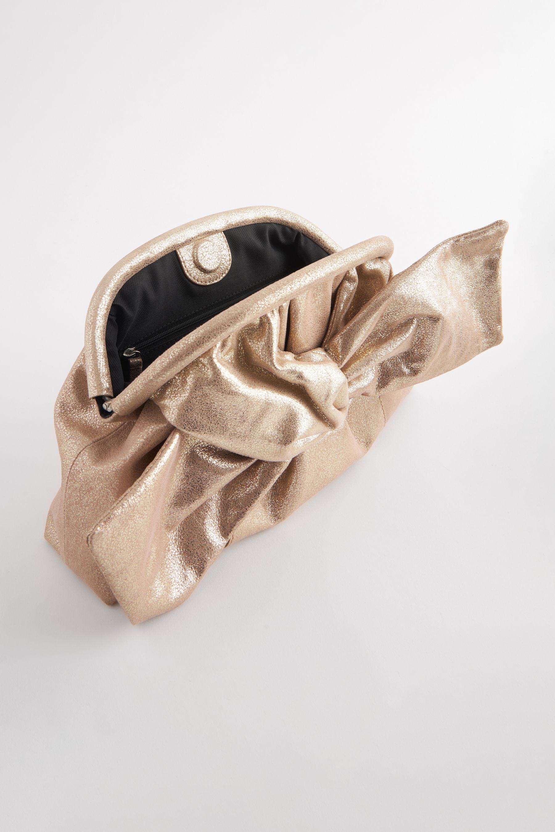 Kaufe Sie Gold Clutch aus Leder mit Zierschleife bei Next Deutschland