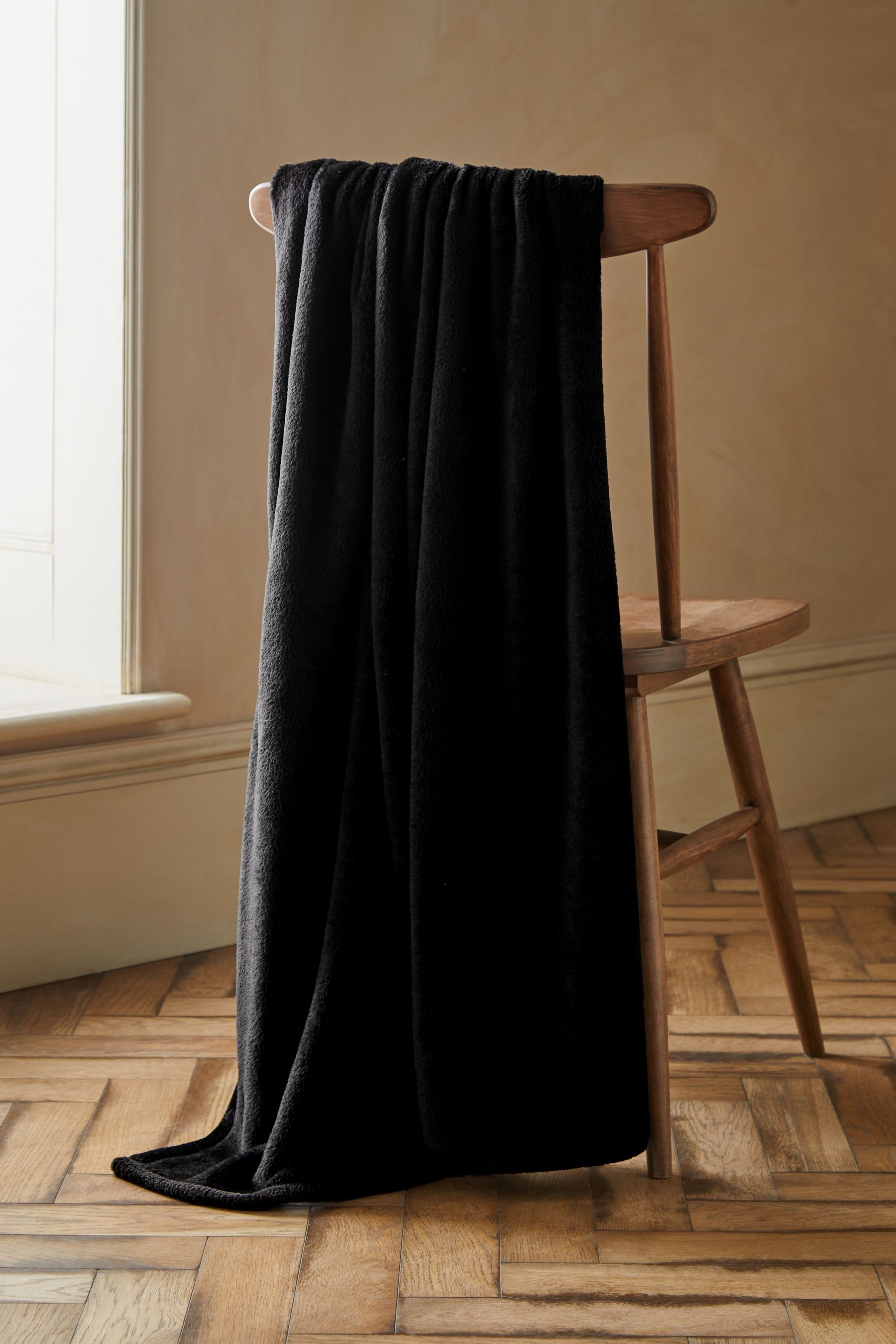 Buy Black Plush Fleece Throw from the Next UK online shop