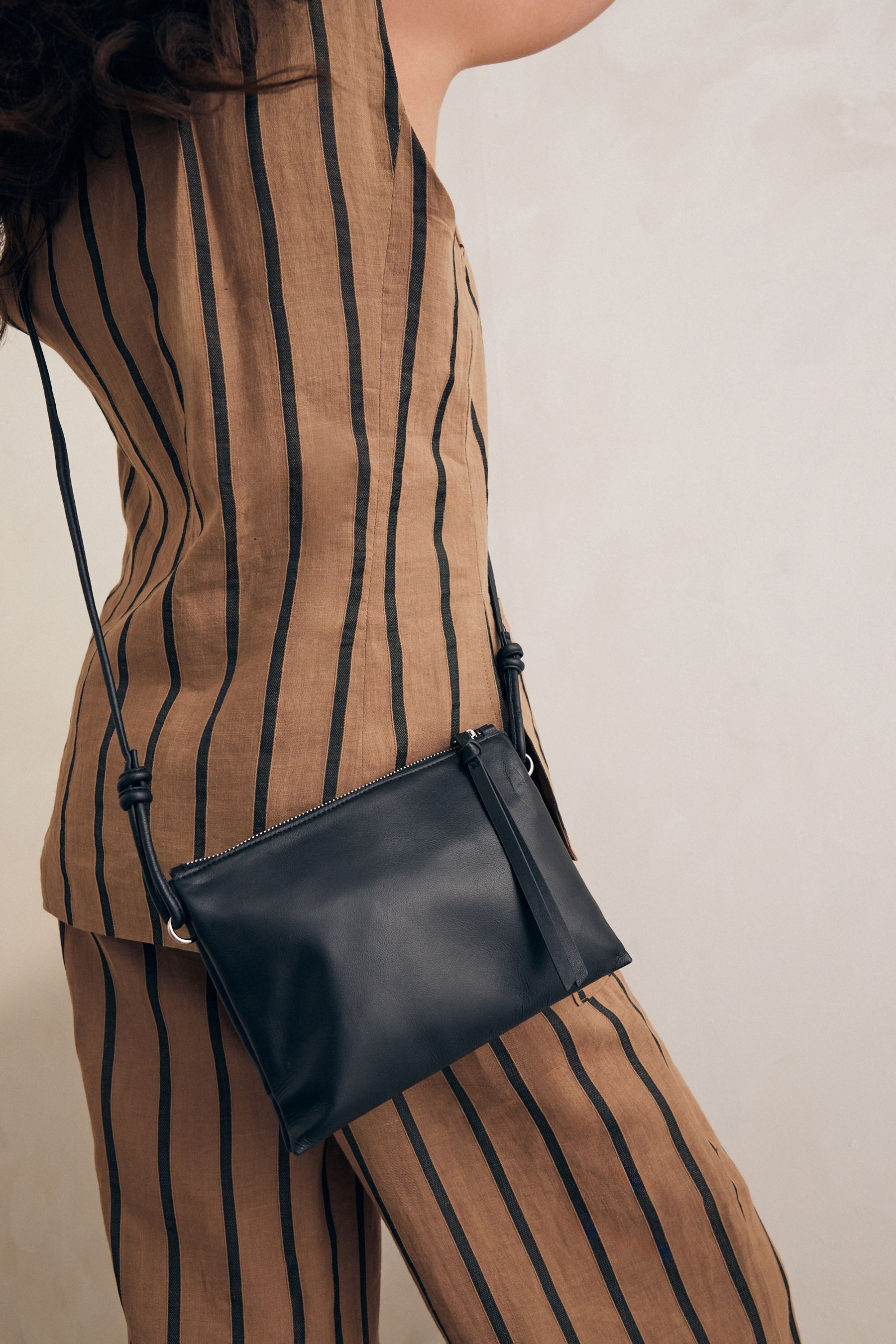 Black leather cross body bag 2025