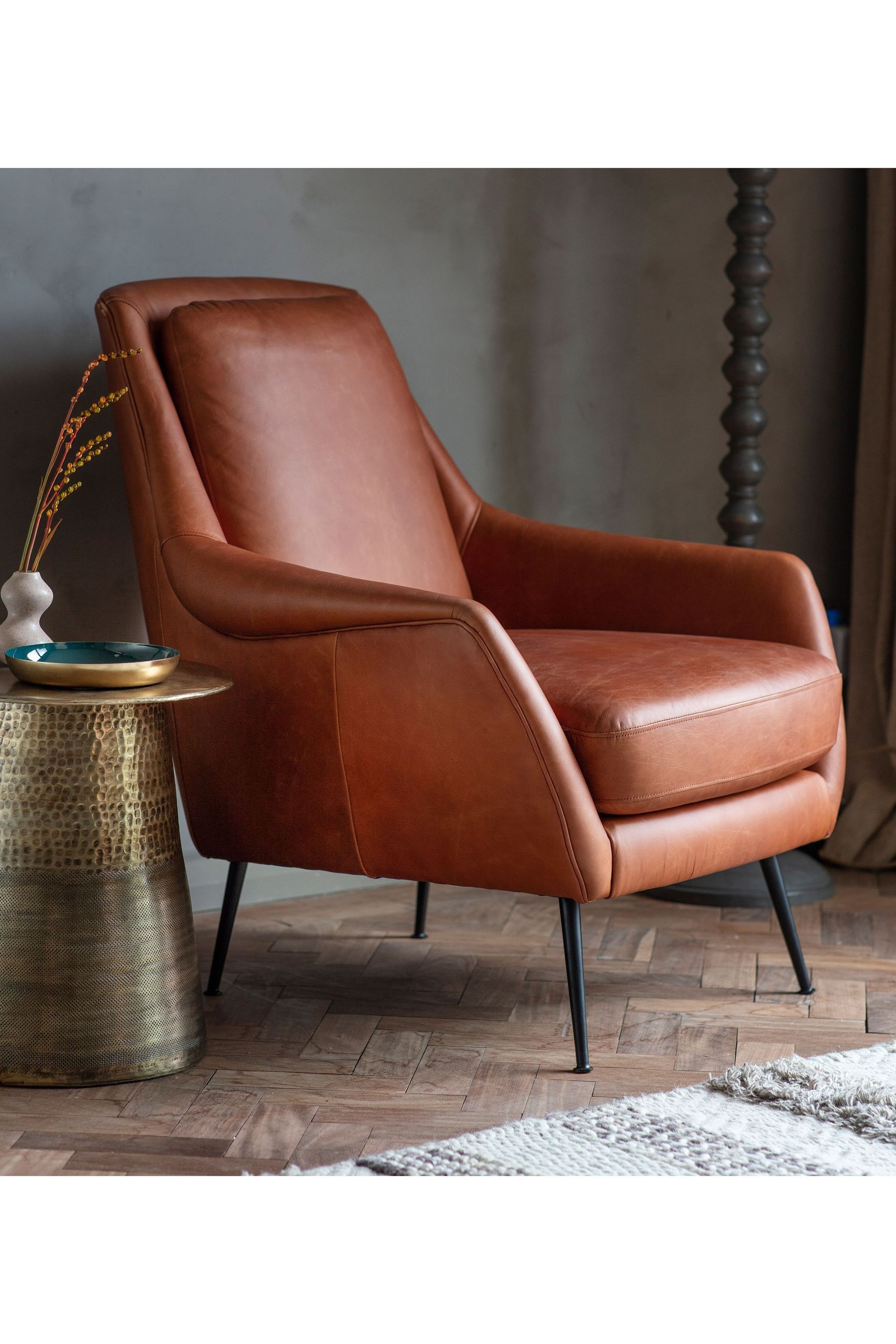 Brown leather shop armchair next