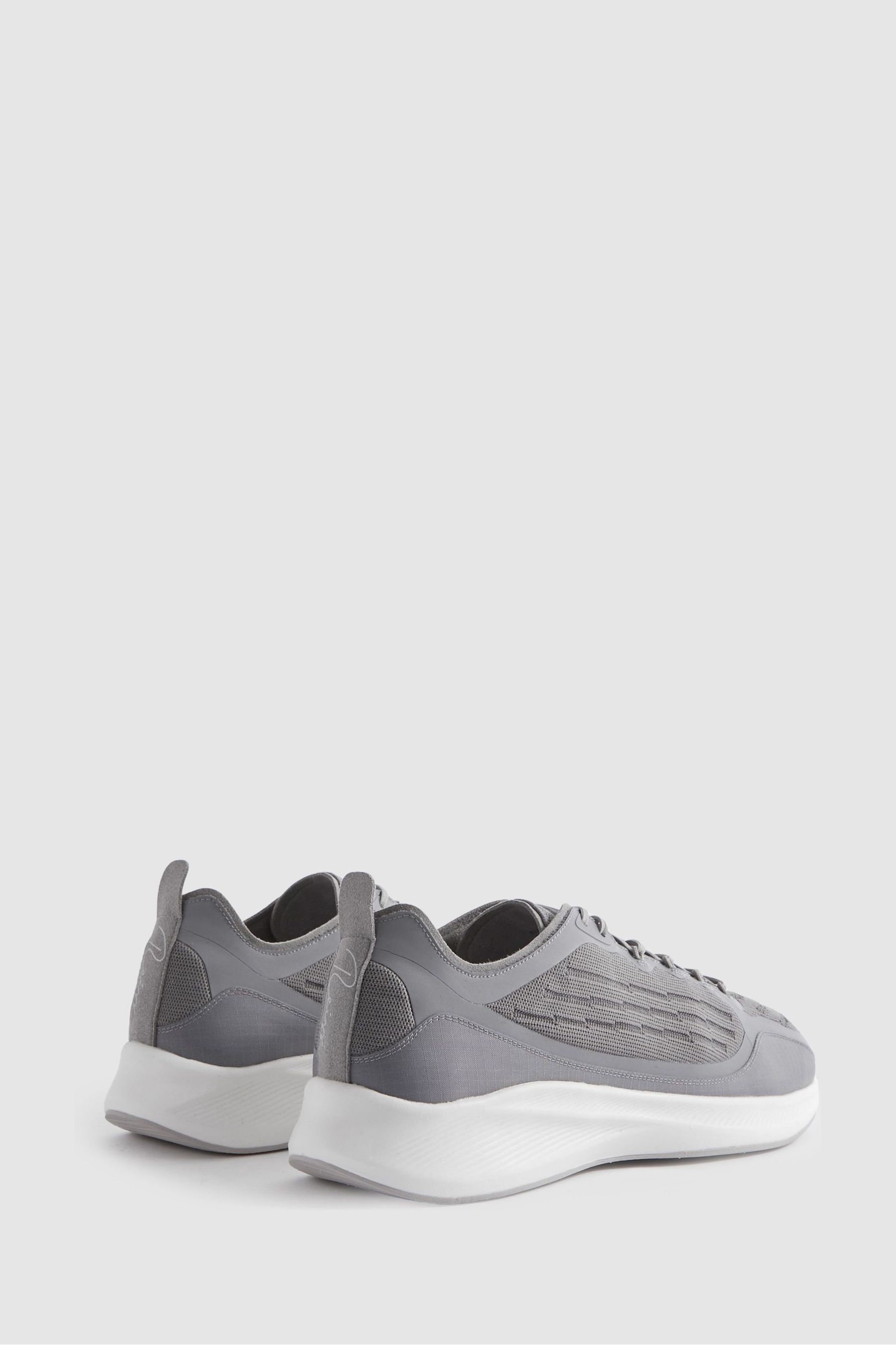 Black knit runner trainers store
