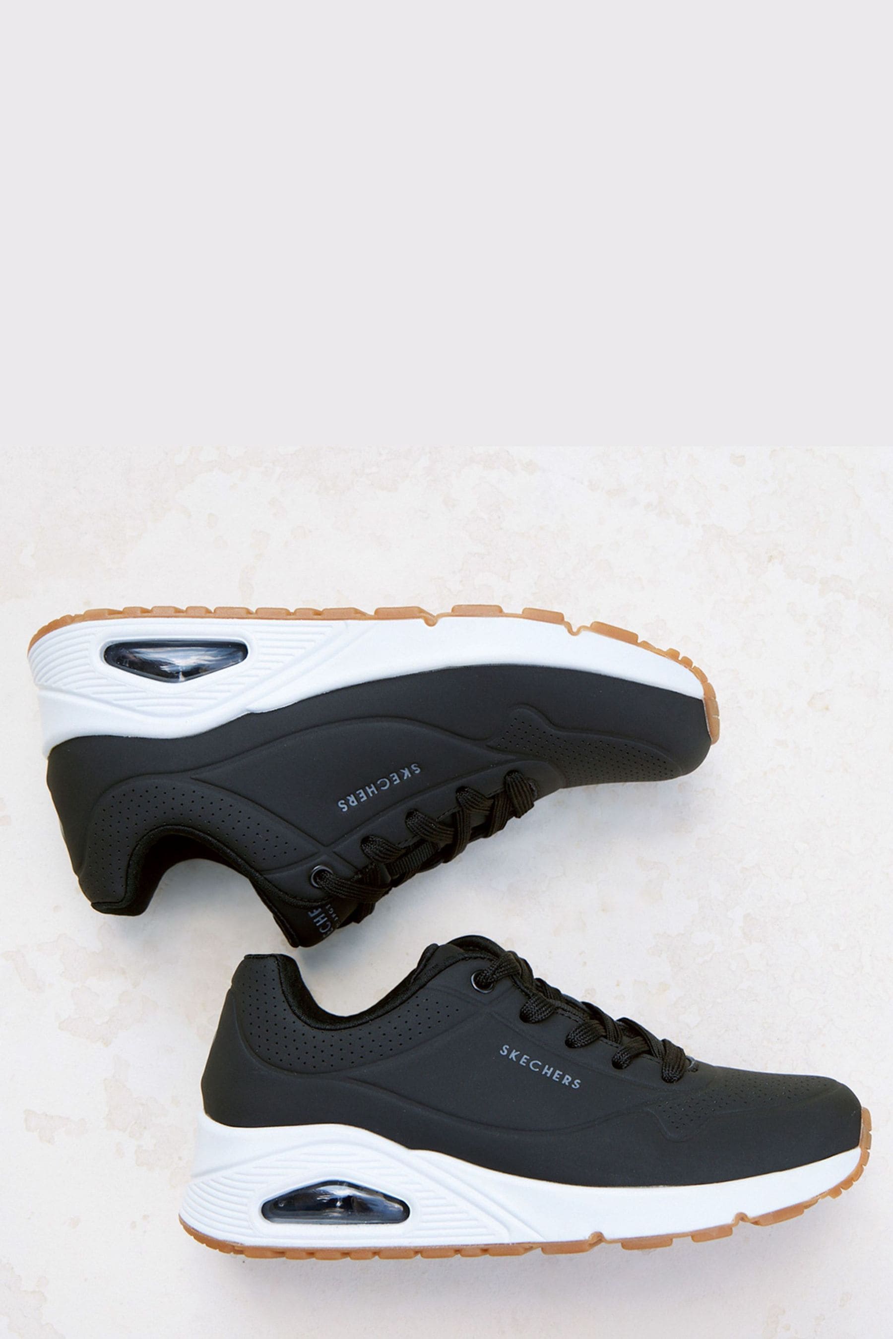 Black and hotsell white skechers trainers