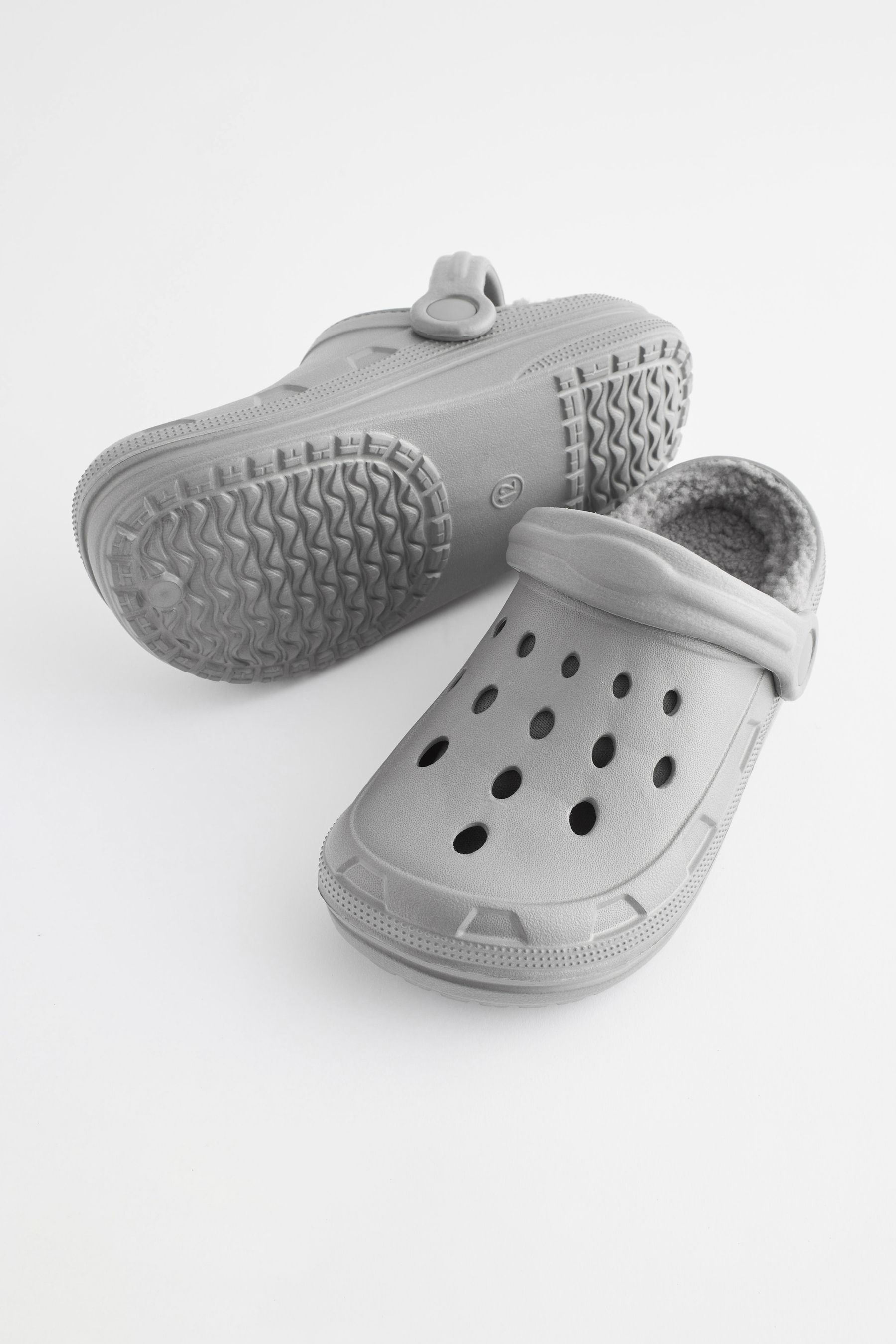 Buy Grey Faux Fur Lined Clog Slippers from the Next UK online shop