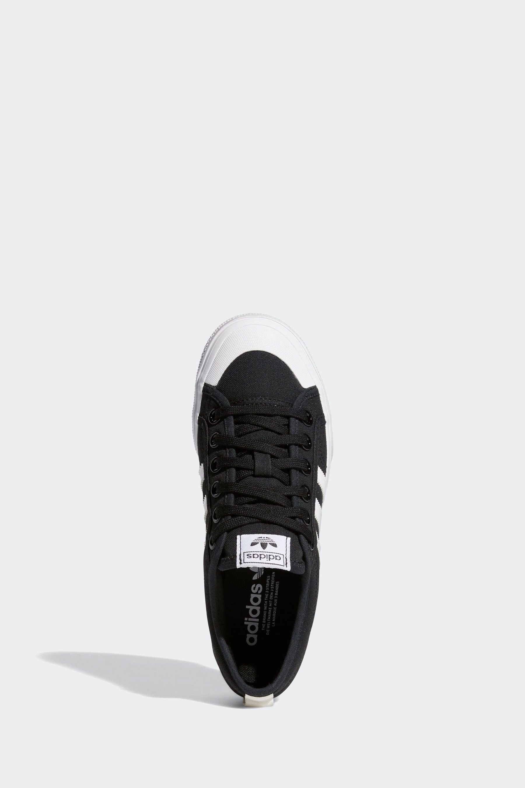 Adidas originals black on sale and white nizza sneakers