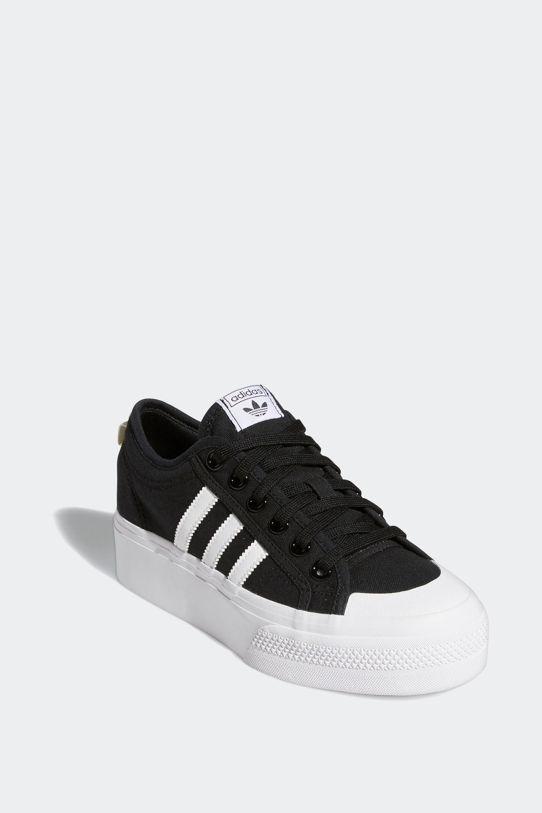 Black nizza trainers top