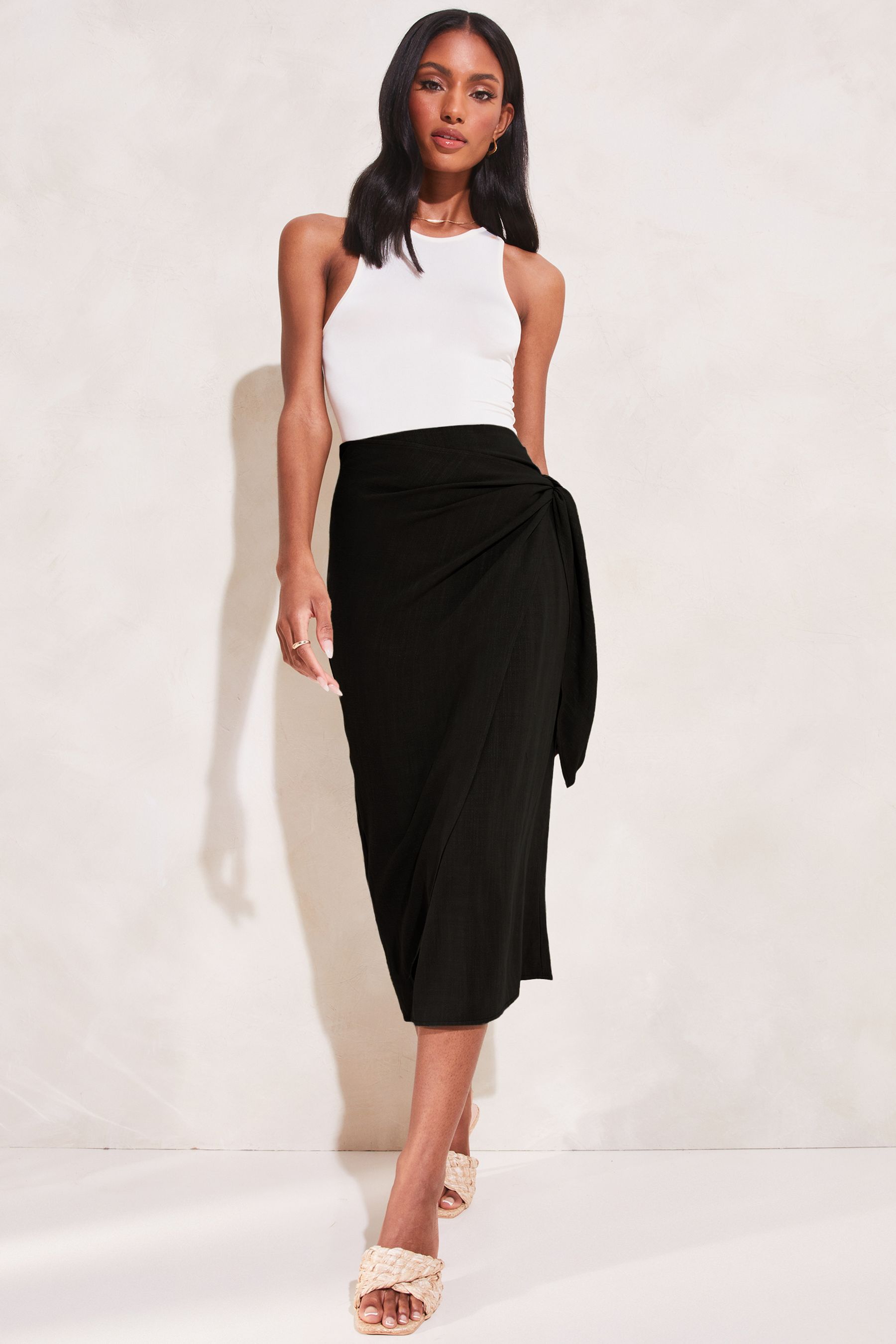 Buy Lipsy Black Tie Waist Wrap Midi Skirt from the Next UK online shop