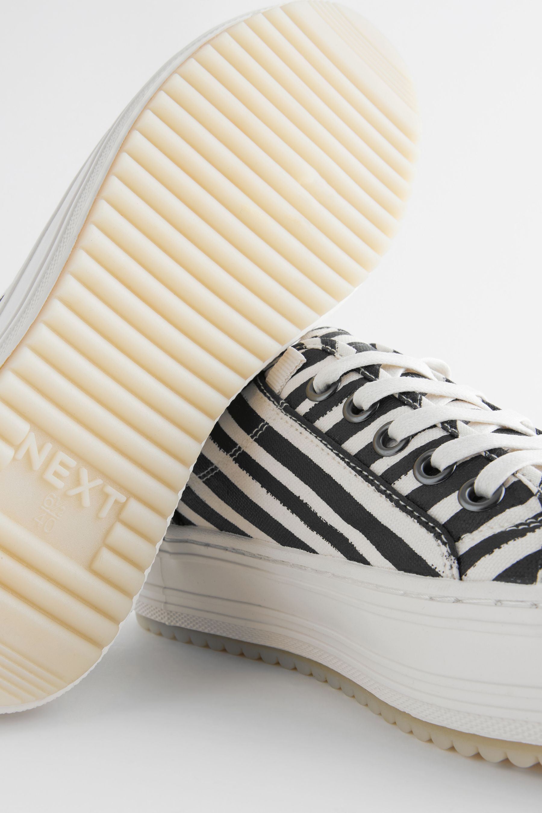 Black trainers white stripe discount