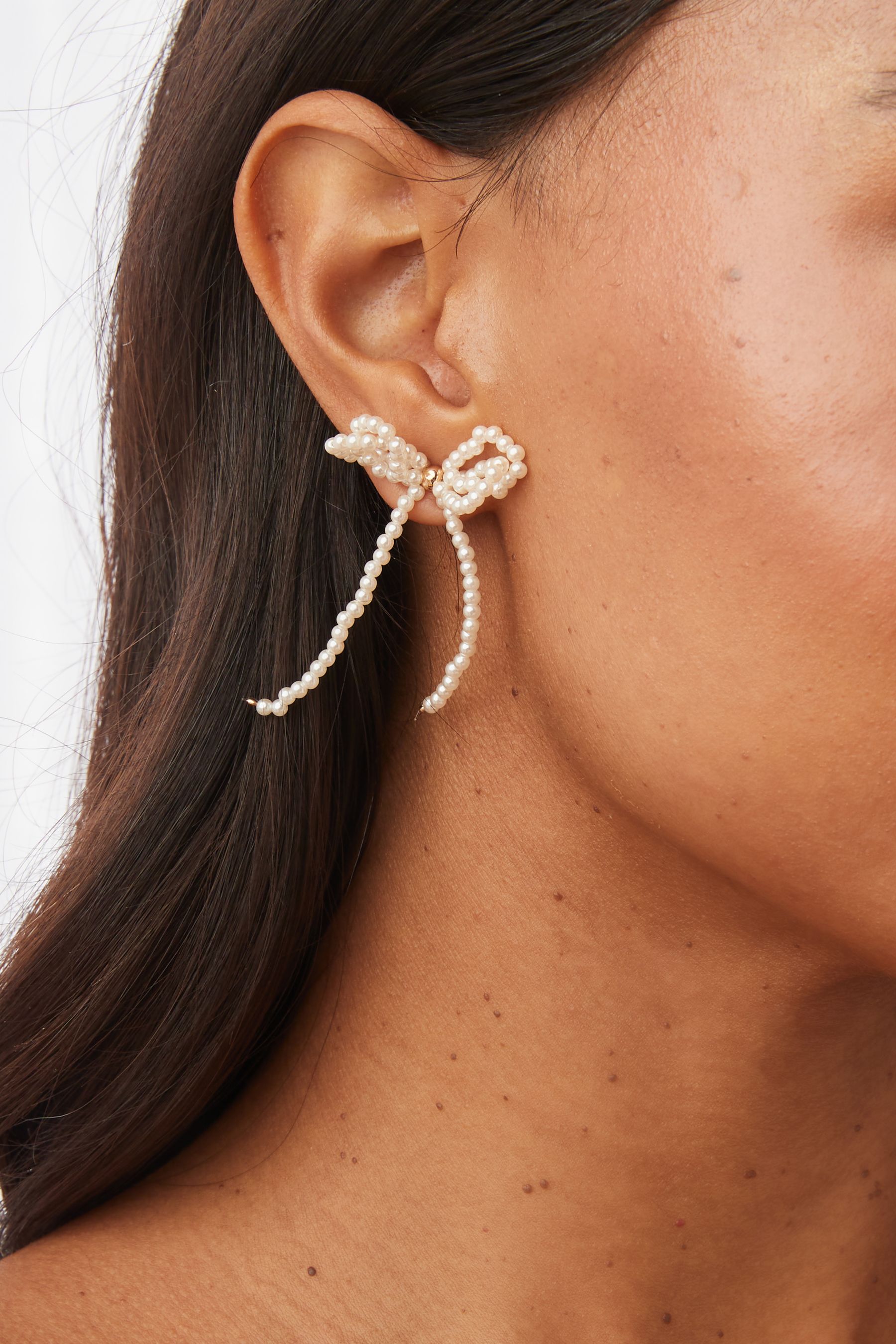 Pearl bow earrings hot sale