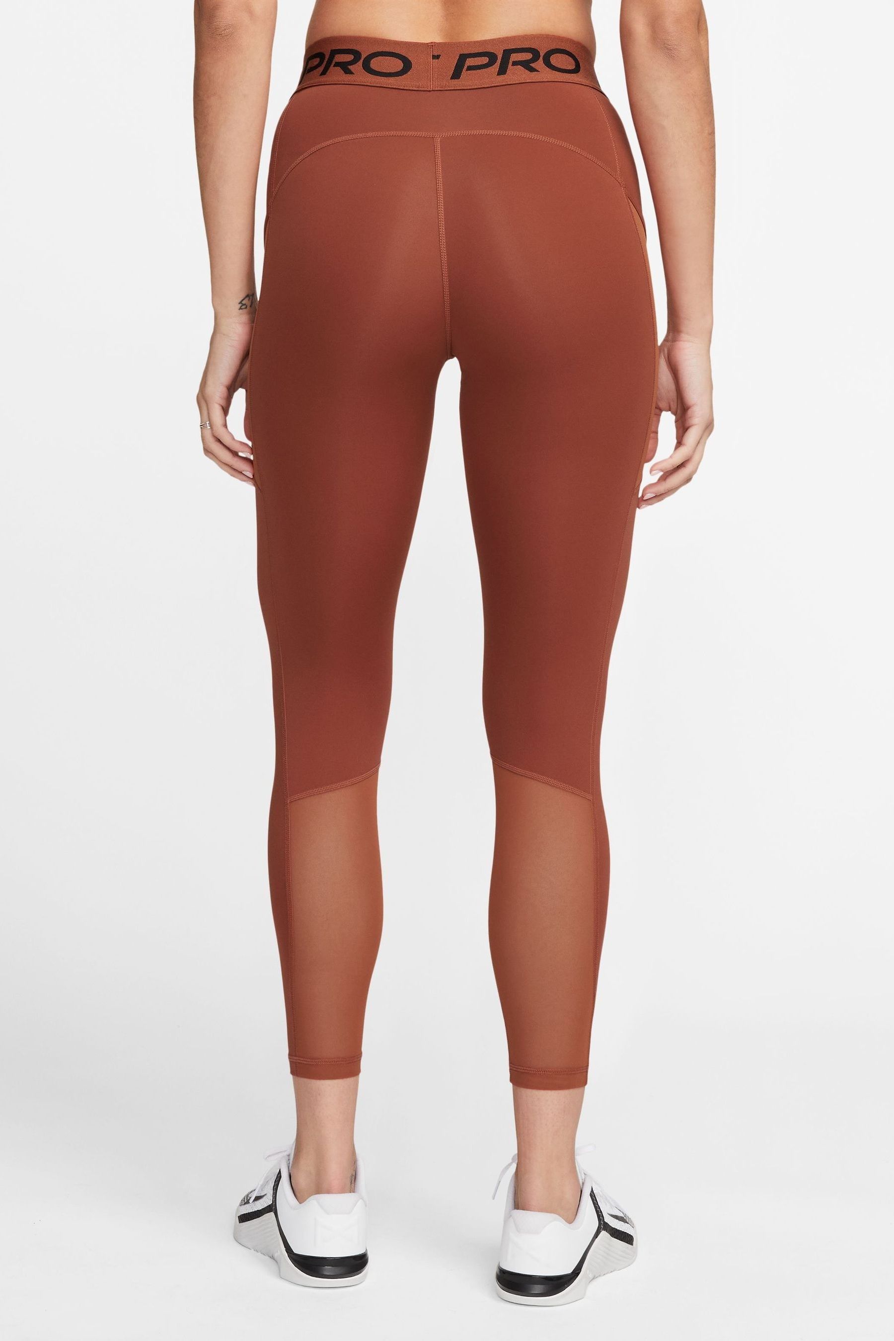 Buy Nike Orange Pro Dri FIT 365 Mid Rise 7 8 Leggings with Pockets from Next Luxembourg