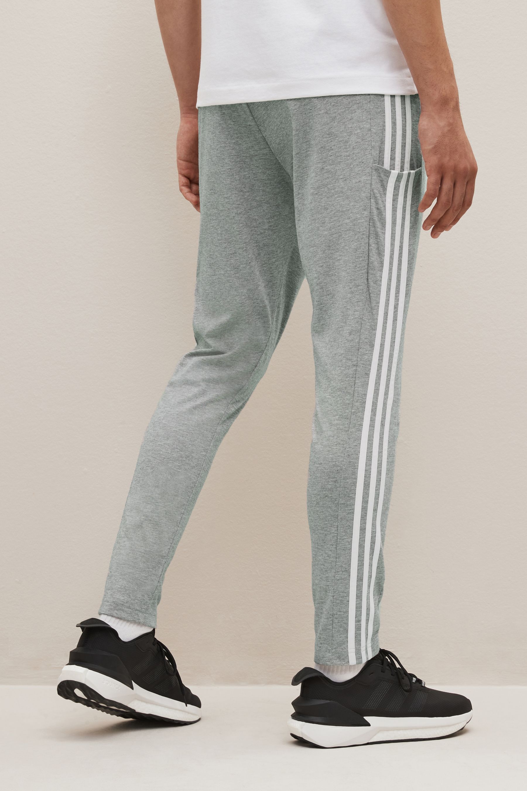 Buy adidas Grey Sportswear Essentials Single Jersey Tapered Open Hem 3 Stripes Joggers from Next Luxembourg