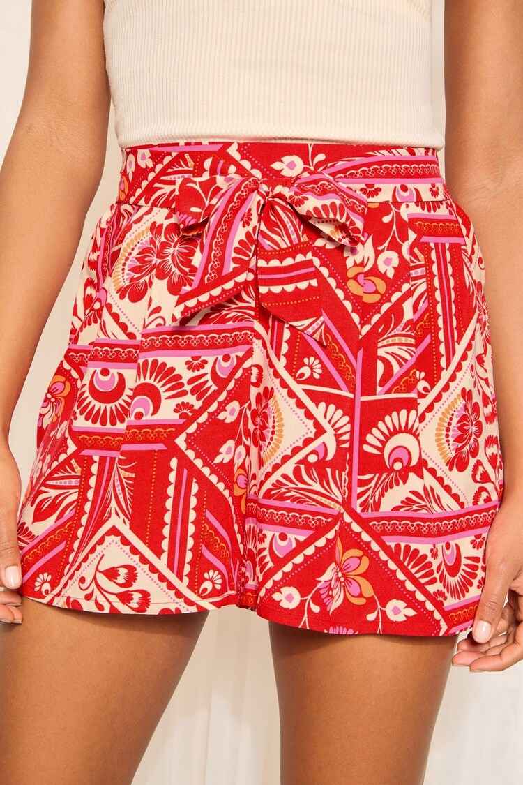 Buy Friends Like These Red Woven Tie Waist Printed Shorts from Next