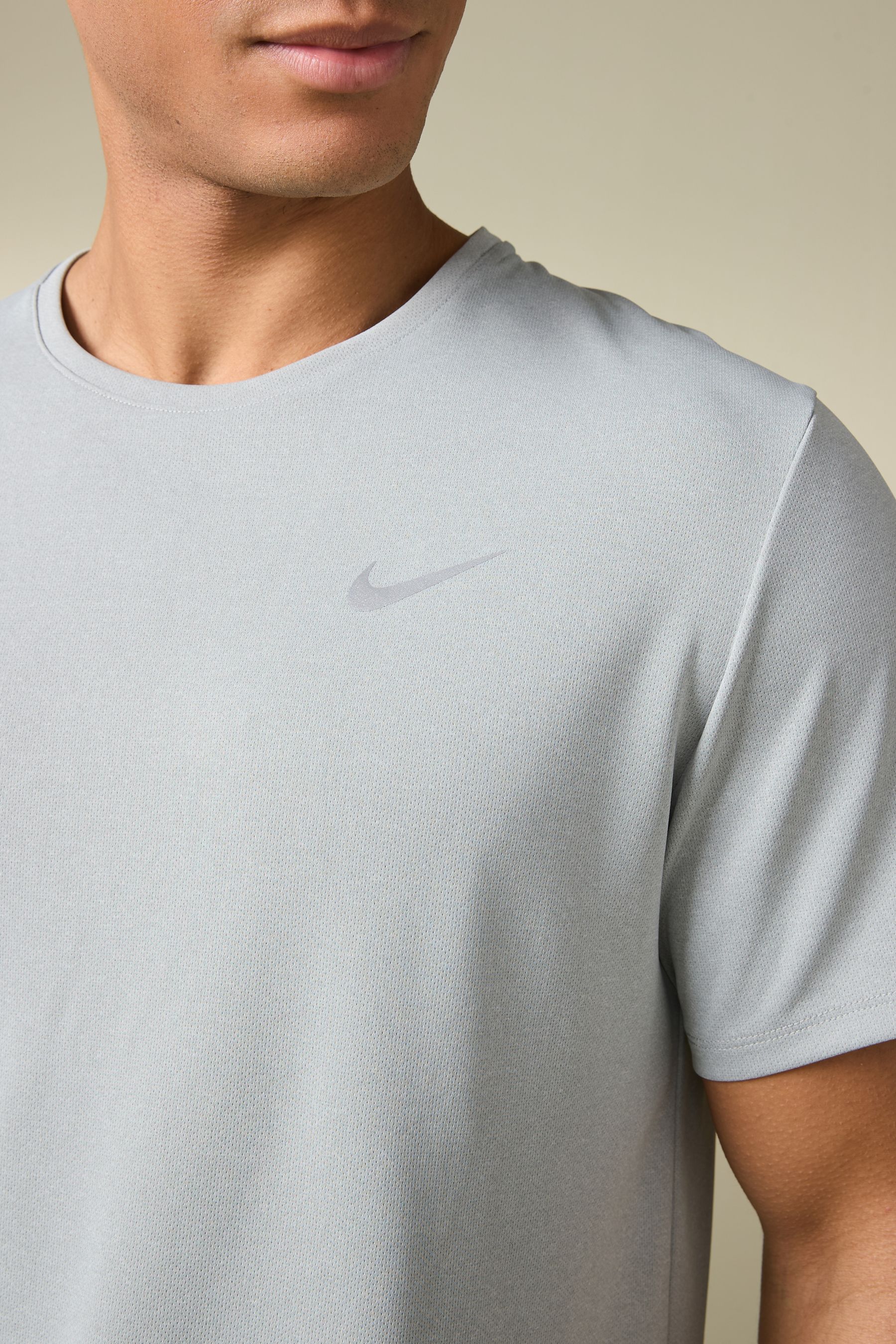 Nike Miler Dri FIT UV Running T Shirt from Next Oman