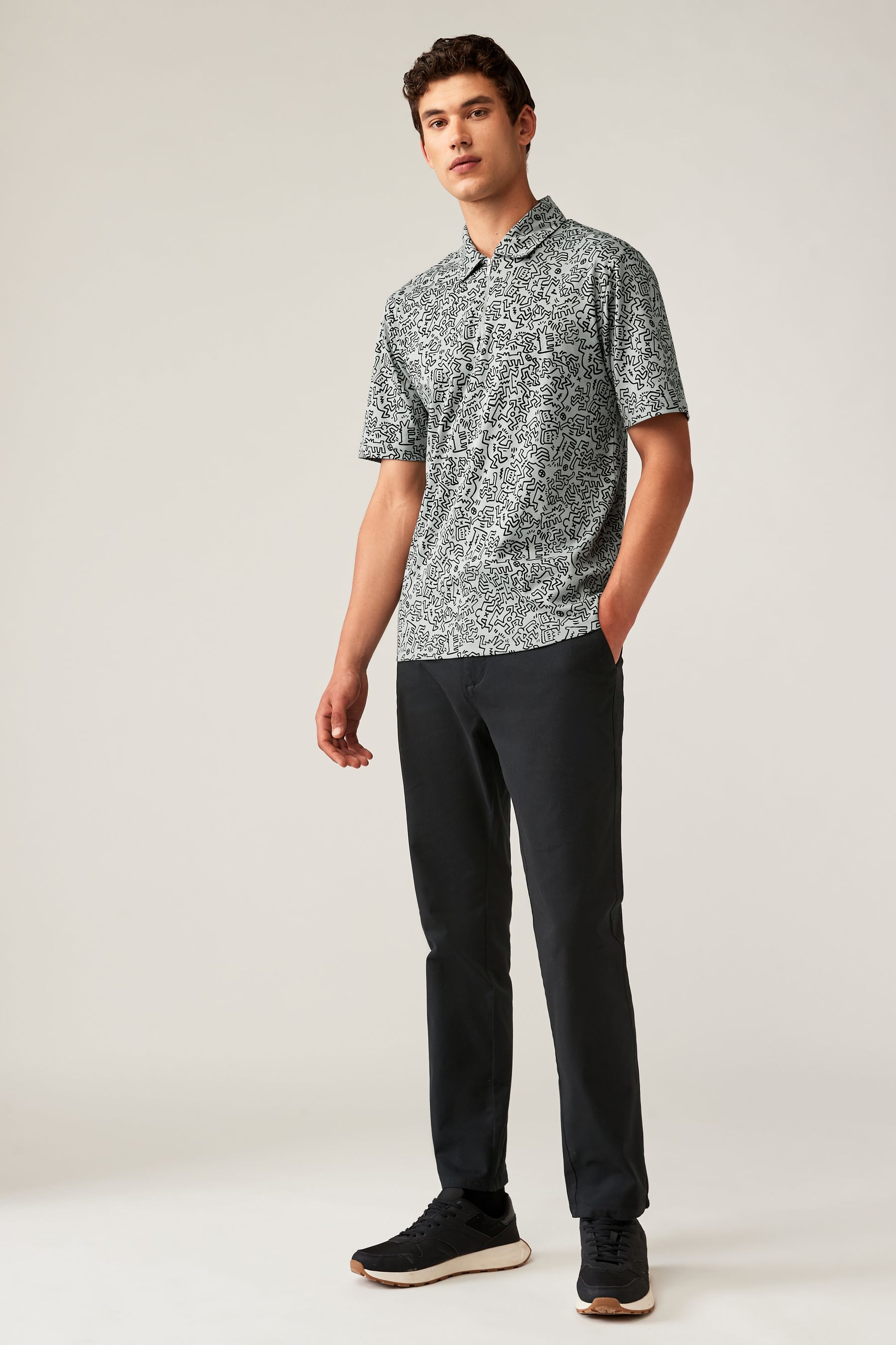 Buy Grey Relaxed Fit Keith Haring 100 Cotton Print Polo Shirt from the Next UK online shop