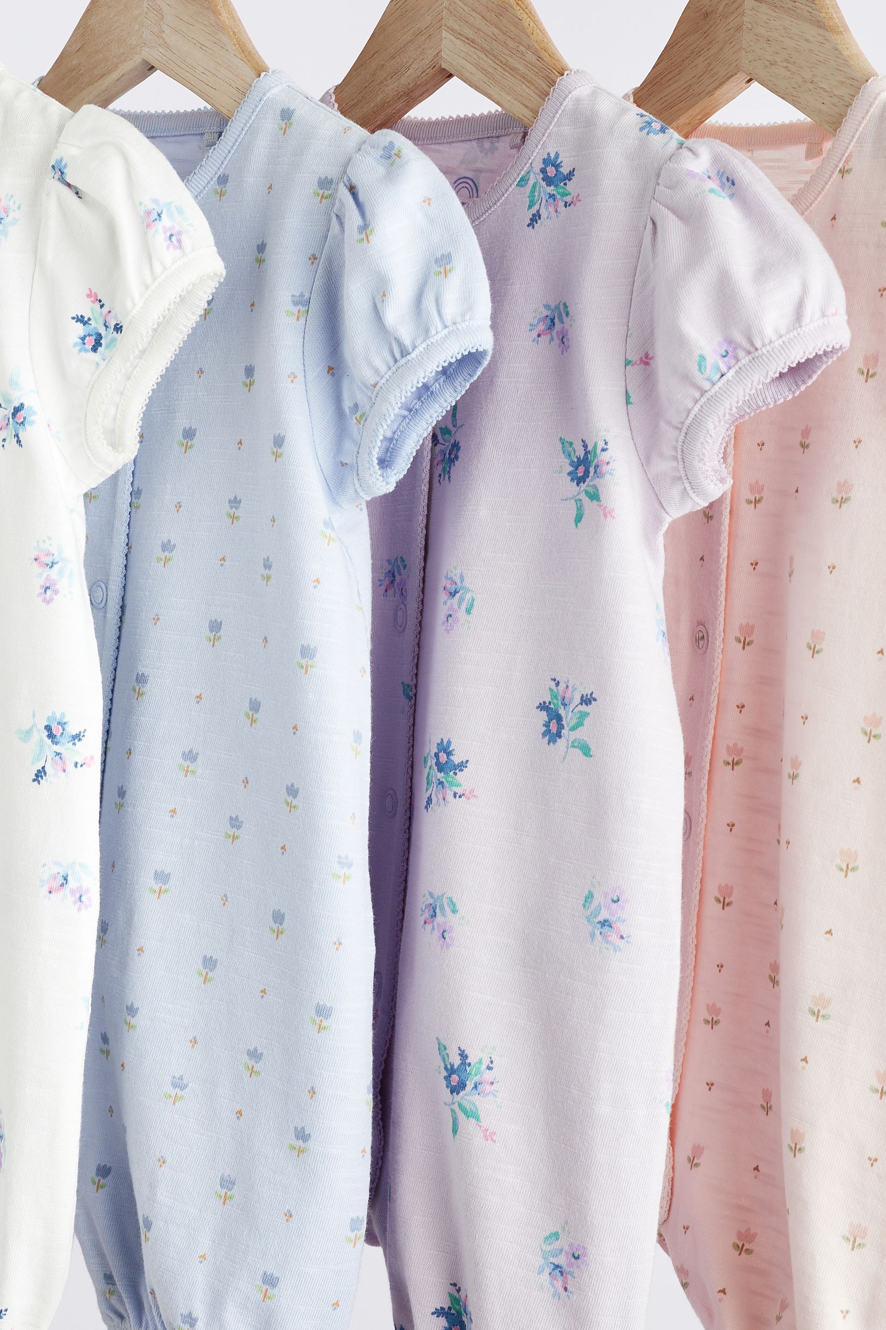 Buy Pink Blue Floral Baby 100 Cotton Rompers 4 Pack from the Next UK online shop