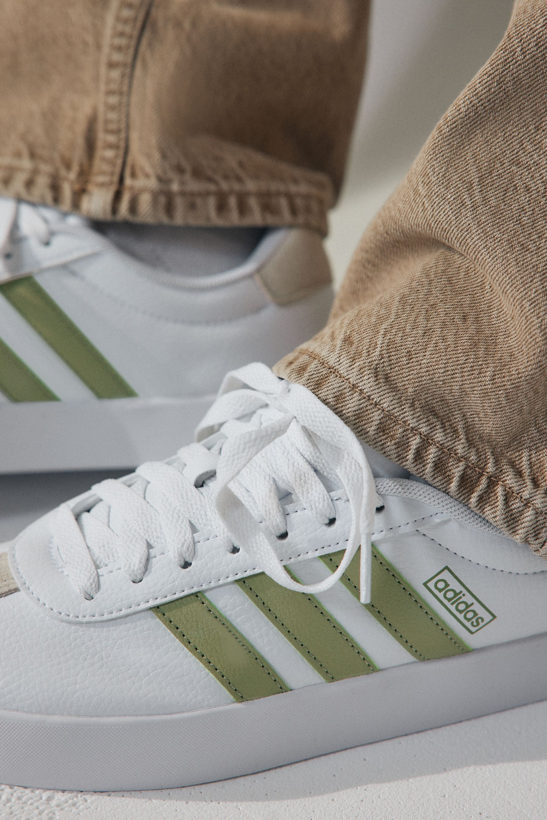 White and green adidas trainers outlet