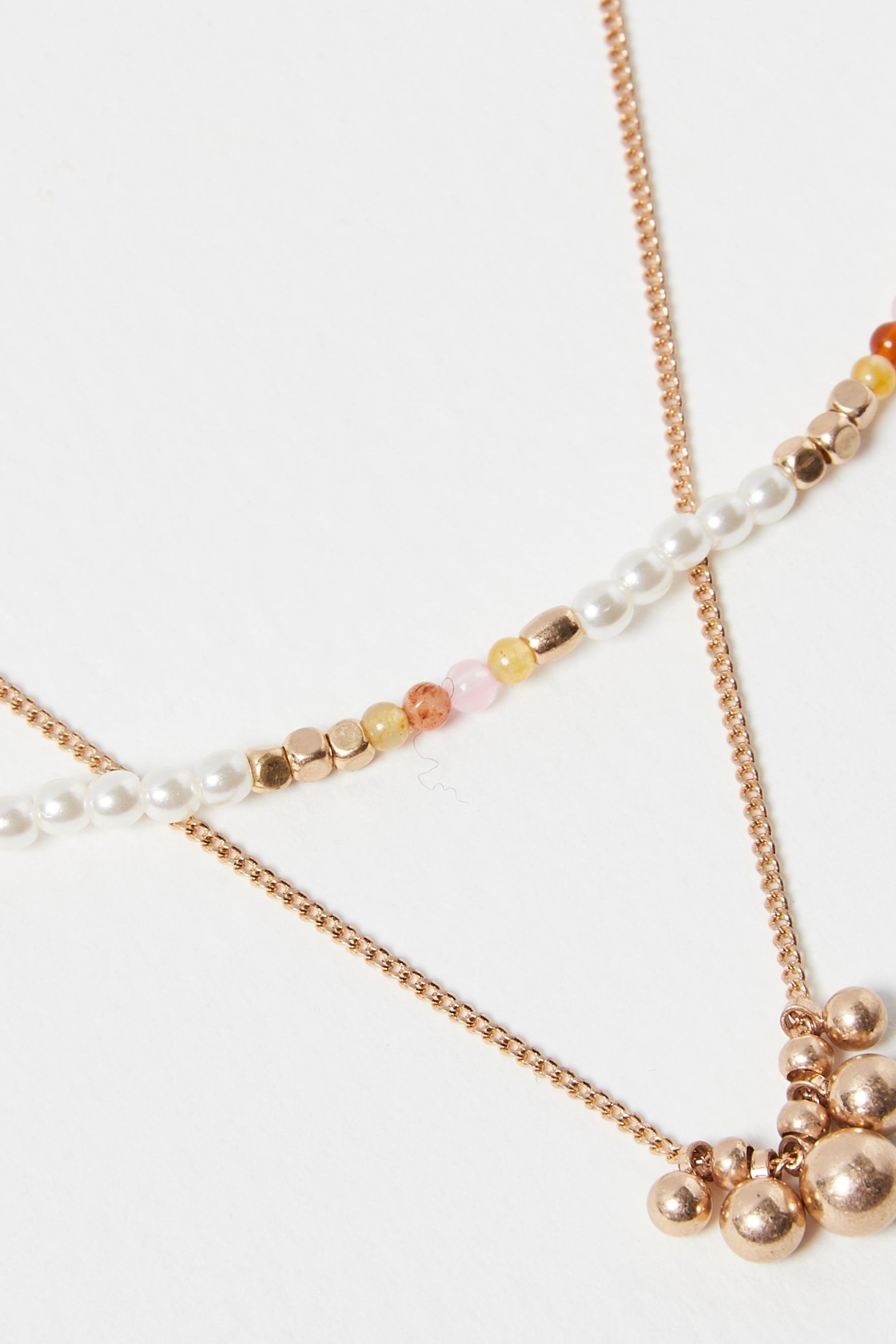 Buy Oliver Bonas Gold Tone Kaia Bead Faux Pearl Chain Double Row Necklace from the Next UK online shop