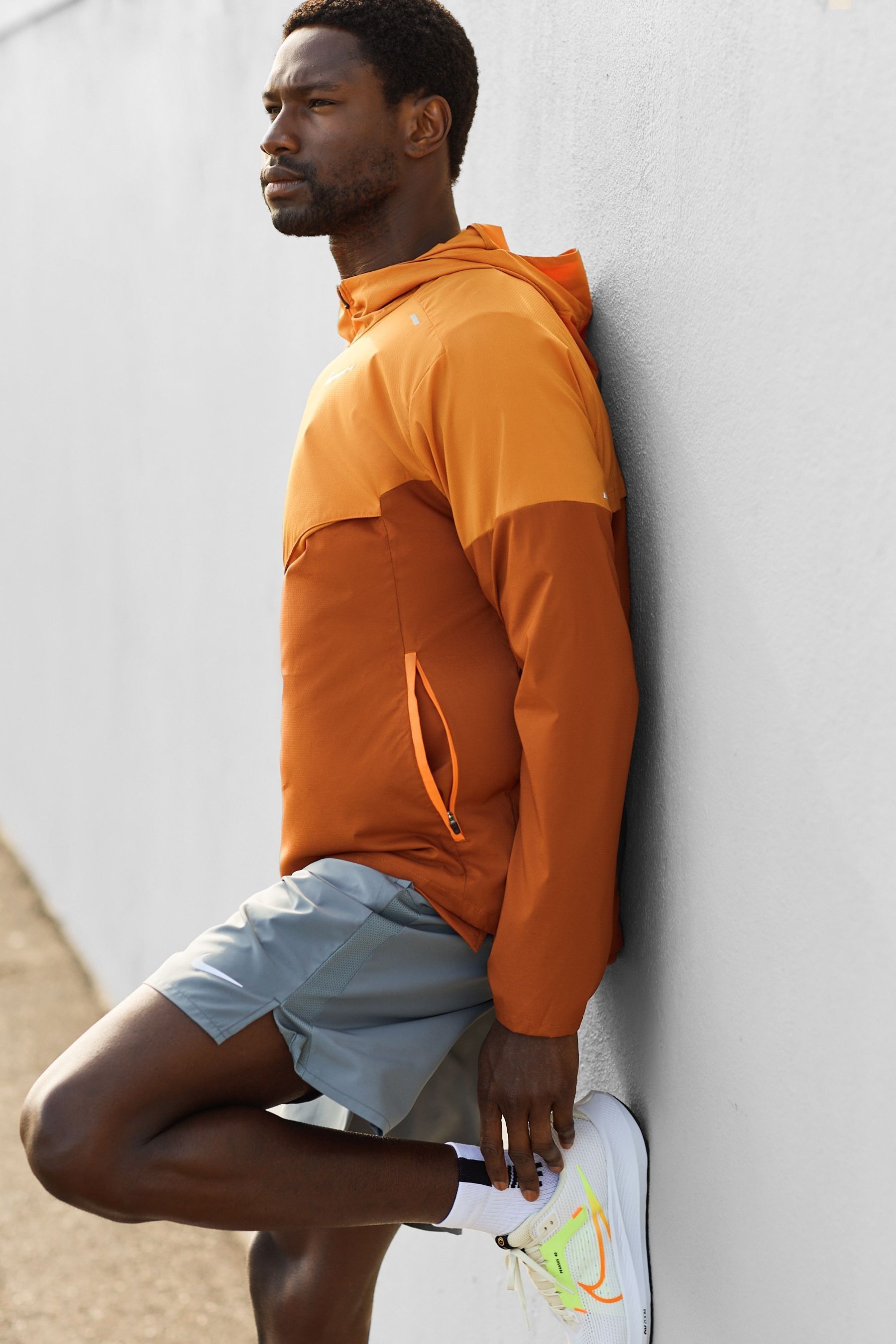 Buy Nike Orange Windrunner Running Jacket from Next Ireland