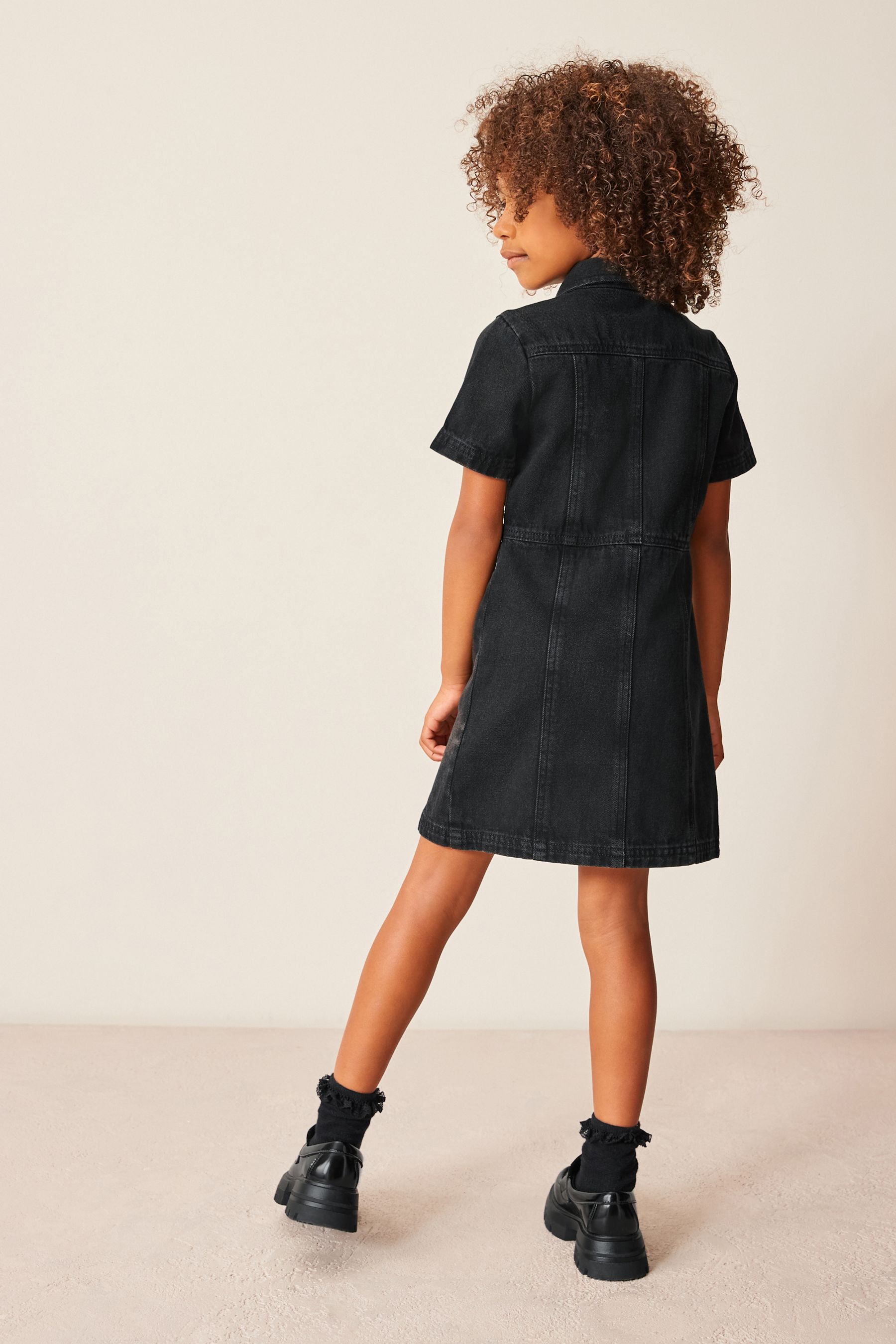 Fitted black denim dress top