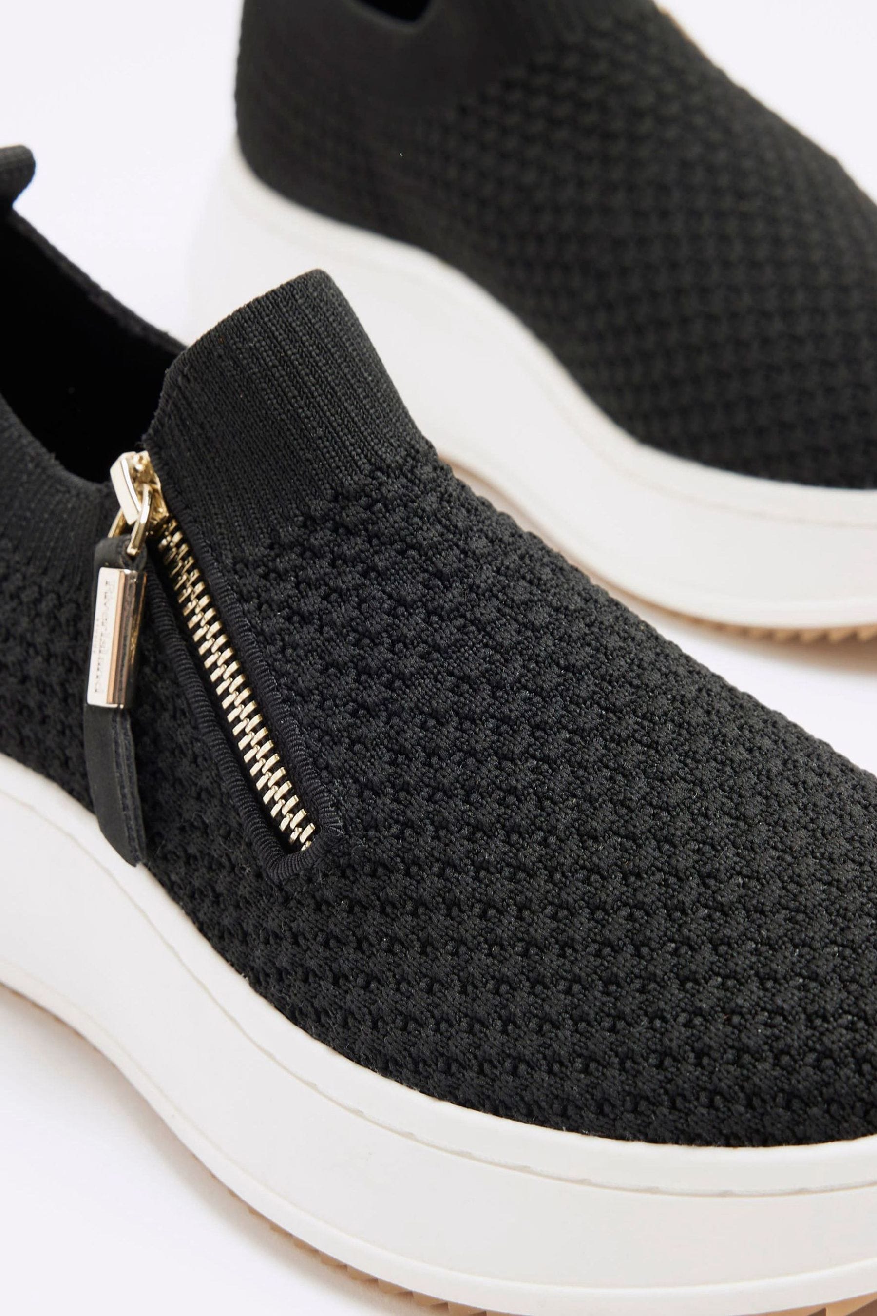 Black and white wedge trainers top