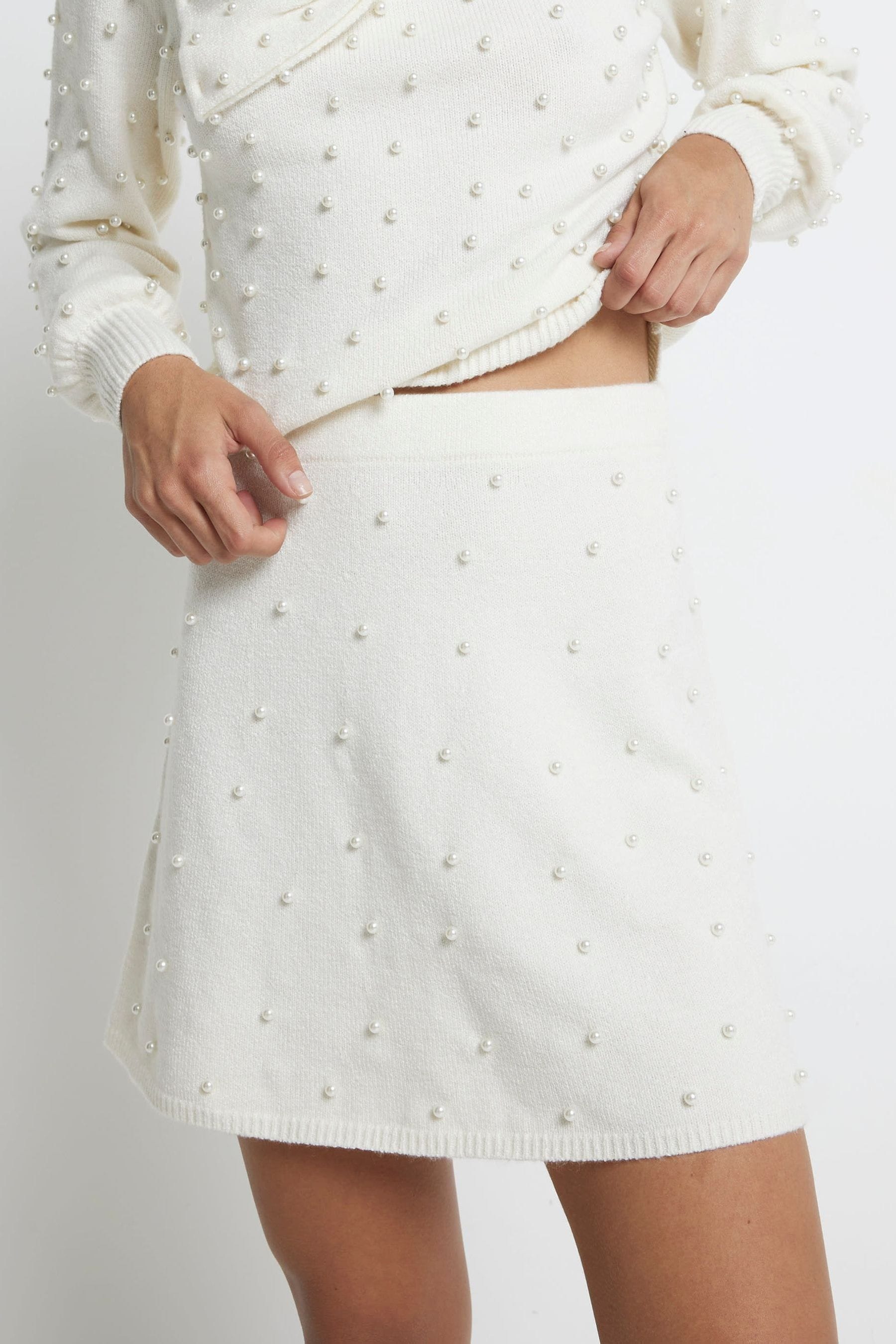 Buy River Island Cream Pearl Detail Flippy Mini Skirt from the Next UK online shop