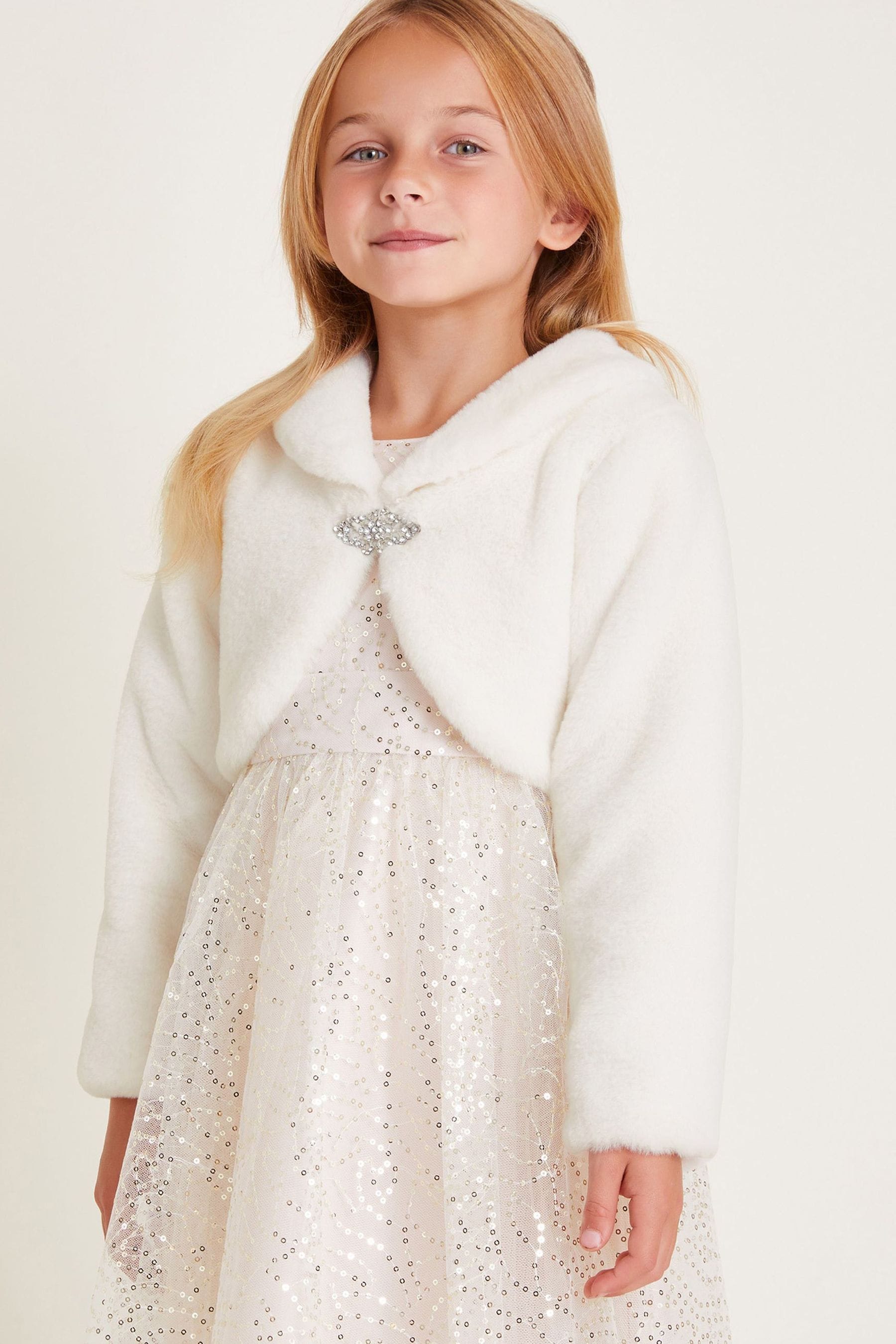 White faux fur shrugs and boleros top