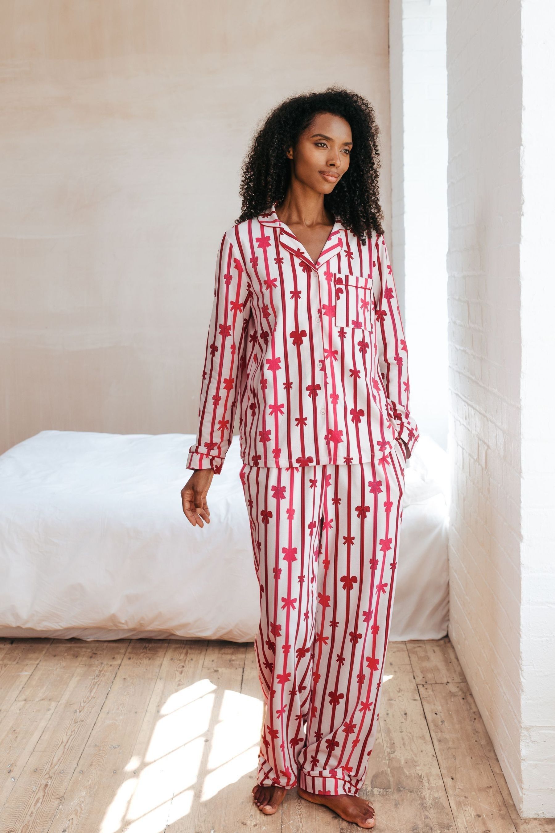 Buy Chelsea Peers White Organic Cotton Christmas Ribbon Bow Print Long Pyjamas Set from the Next UK online shop