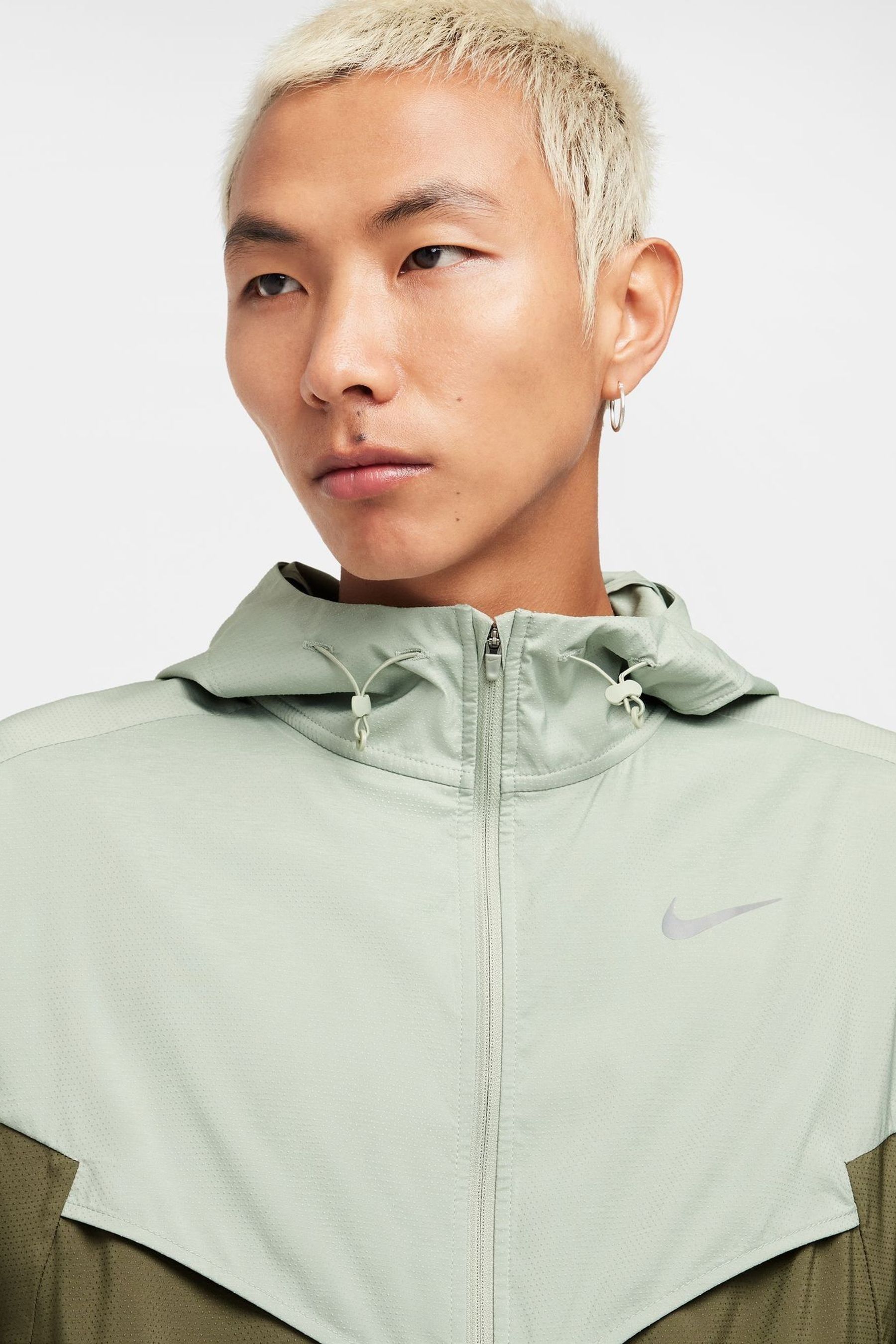Buy Nike Light green Light Windrunner Running Jacket from Next Ireland