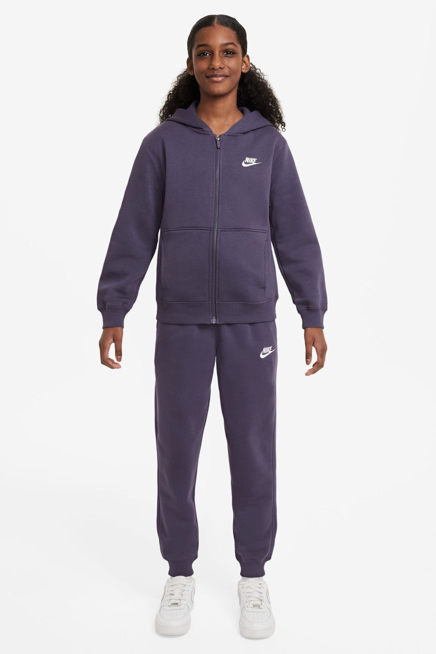 Nike woven tracksuit online