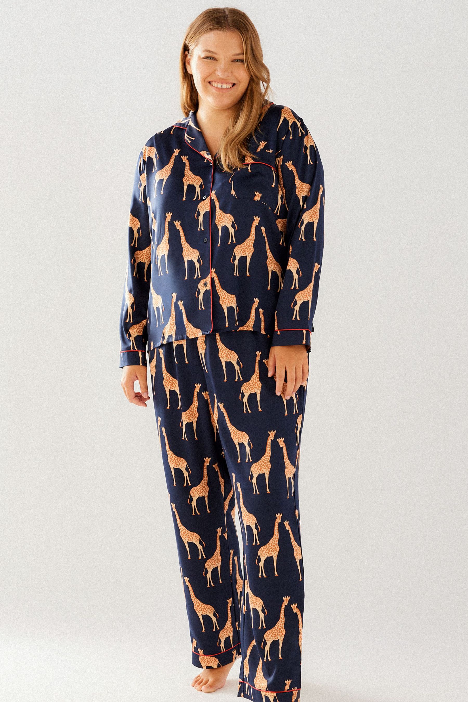 Buy Chelsea Peers Blue Curve Satin Giraffe Print Long Pyjama Set from Next Luxembourg