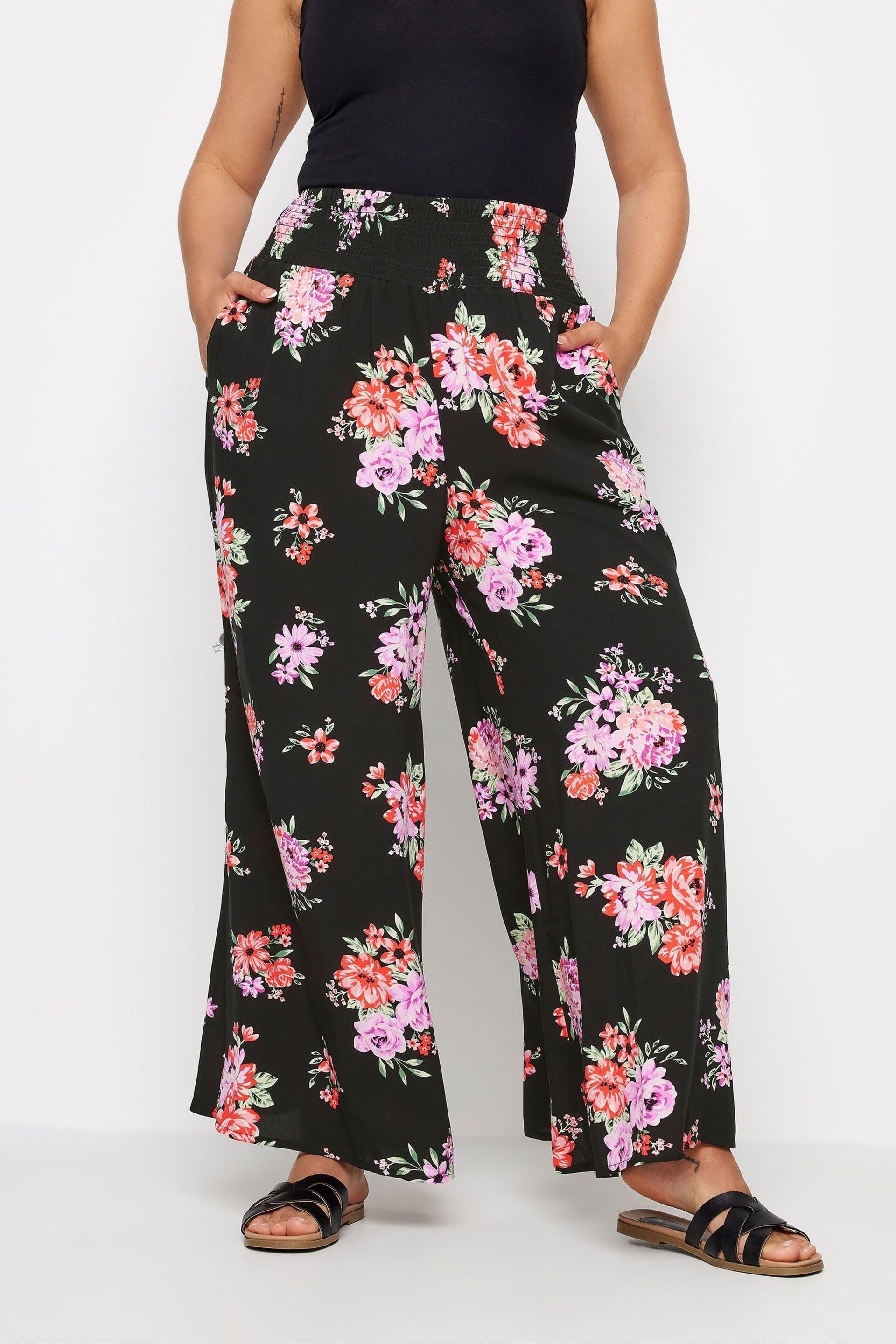 Yours Curve Black Floral Bloom Print Shirred Wide Leg Trousers - Image 1 of 5