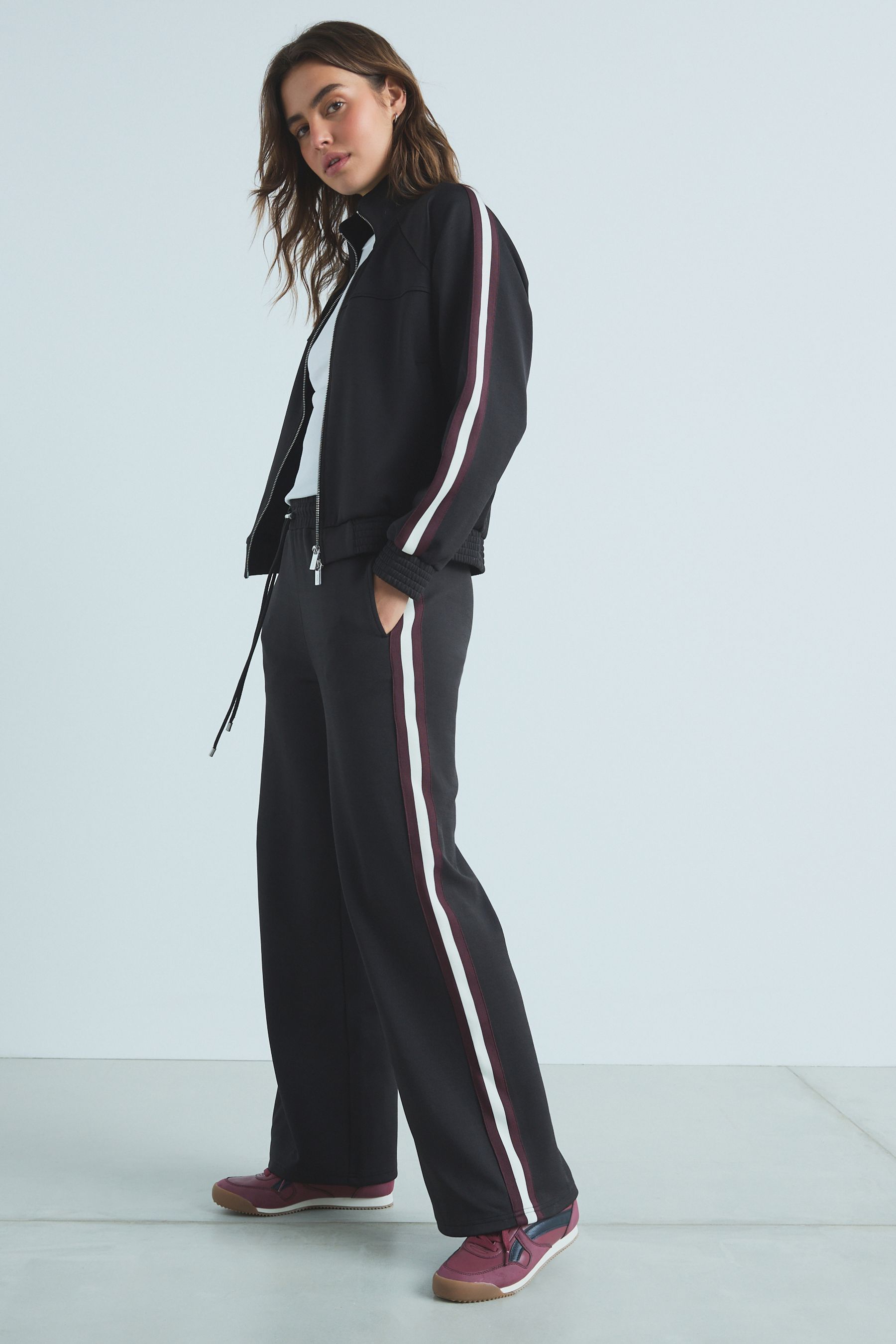 Black joggers with white stripe hotsell