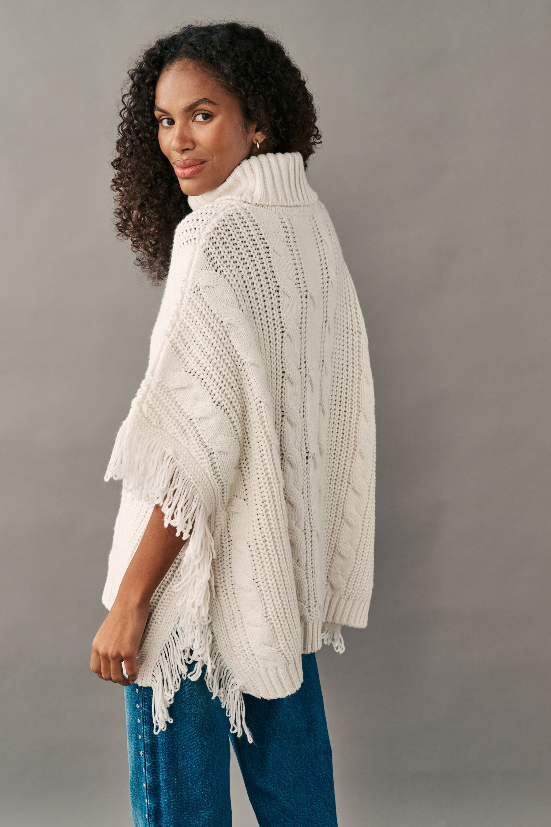Buy White Ecru High Roll Neck Fringe Knitted Cape Cardigan With Wool from the Next UK online shop