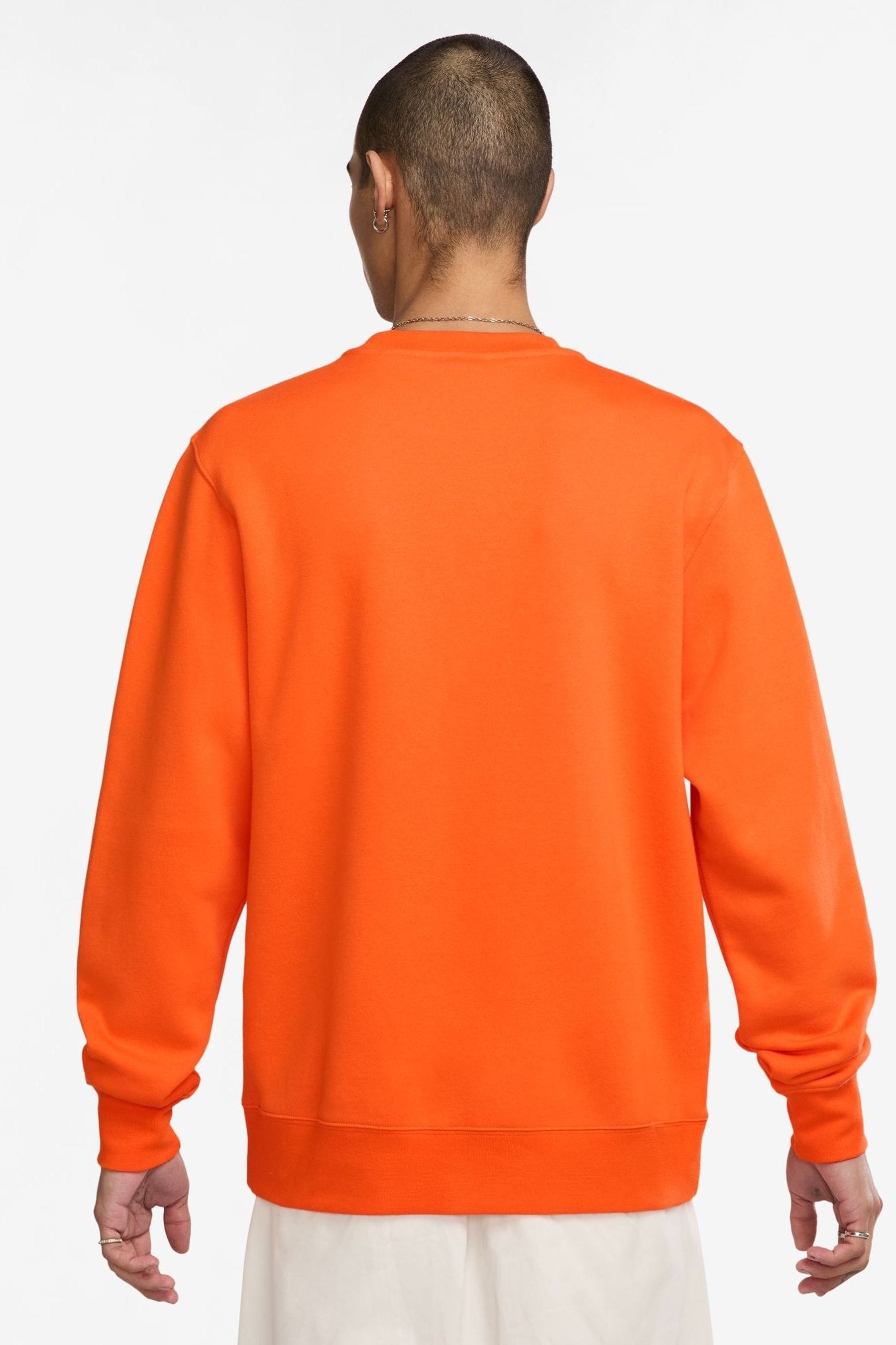 Orange sweatsuit nike 2025