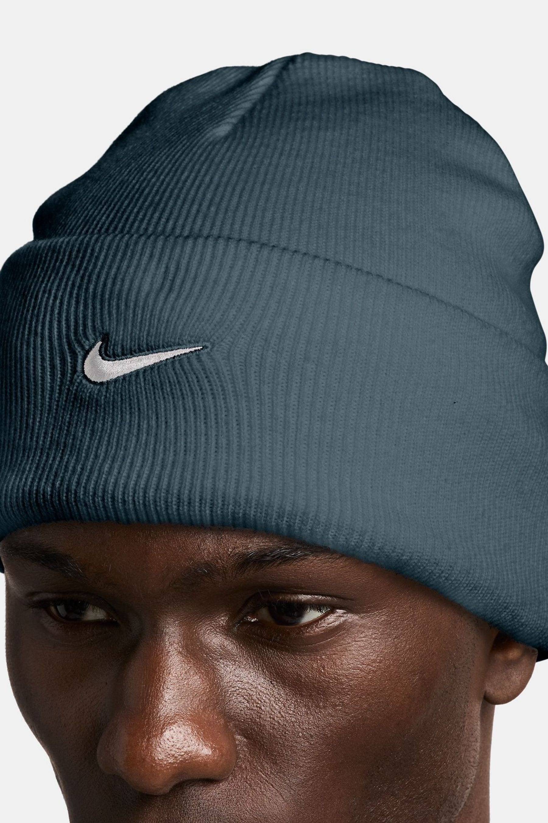 Nike swoosh beanie top