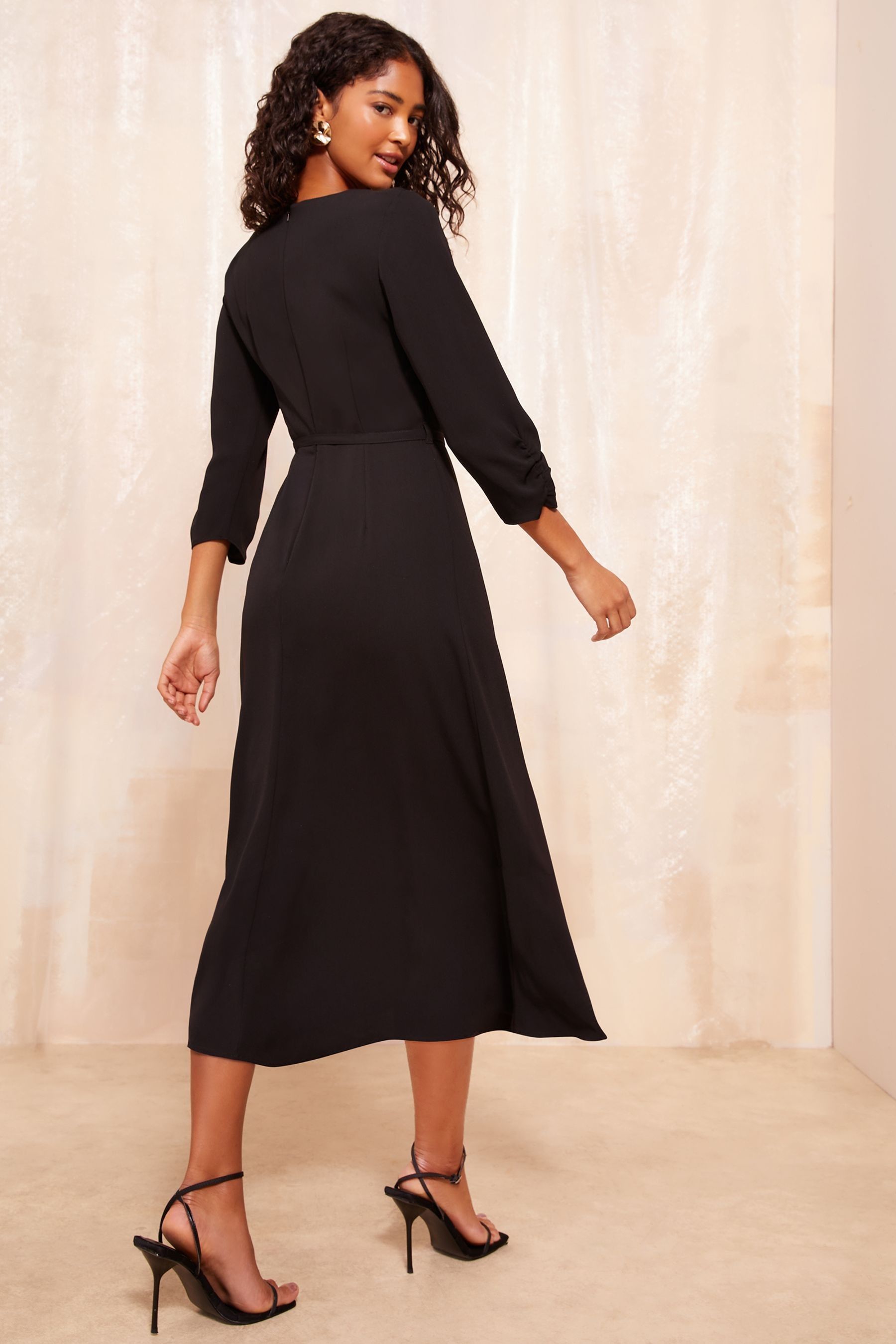 Buy Friends Like These Black Petite Tulip Sleeve Belted Flute Hem Dress from the Next UK online shop