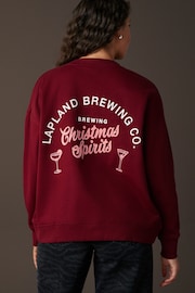 Burgundy Red/Berry Festive Spirits Christmas Lapland Brewing Co Fun Graphic Crew Neck Sweatshirt - Image 1 of 8