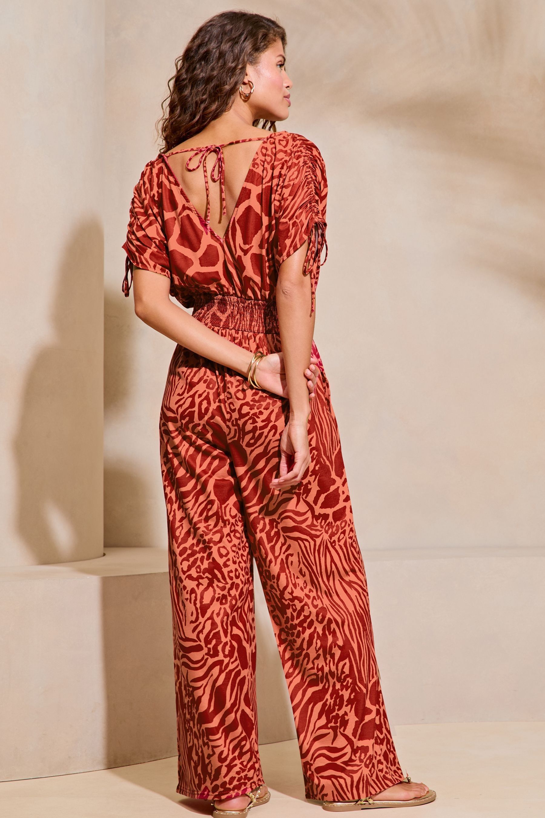 Buy Lipsy Red Animal Print V Neck Wrap Holiday Shop Jumpsuit from the Next UK online shop