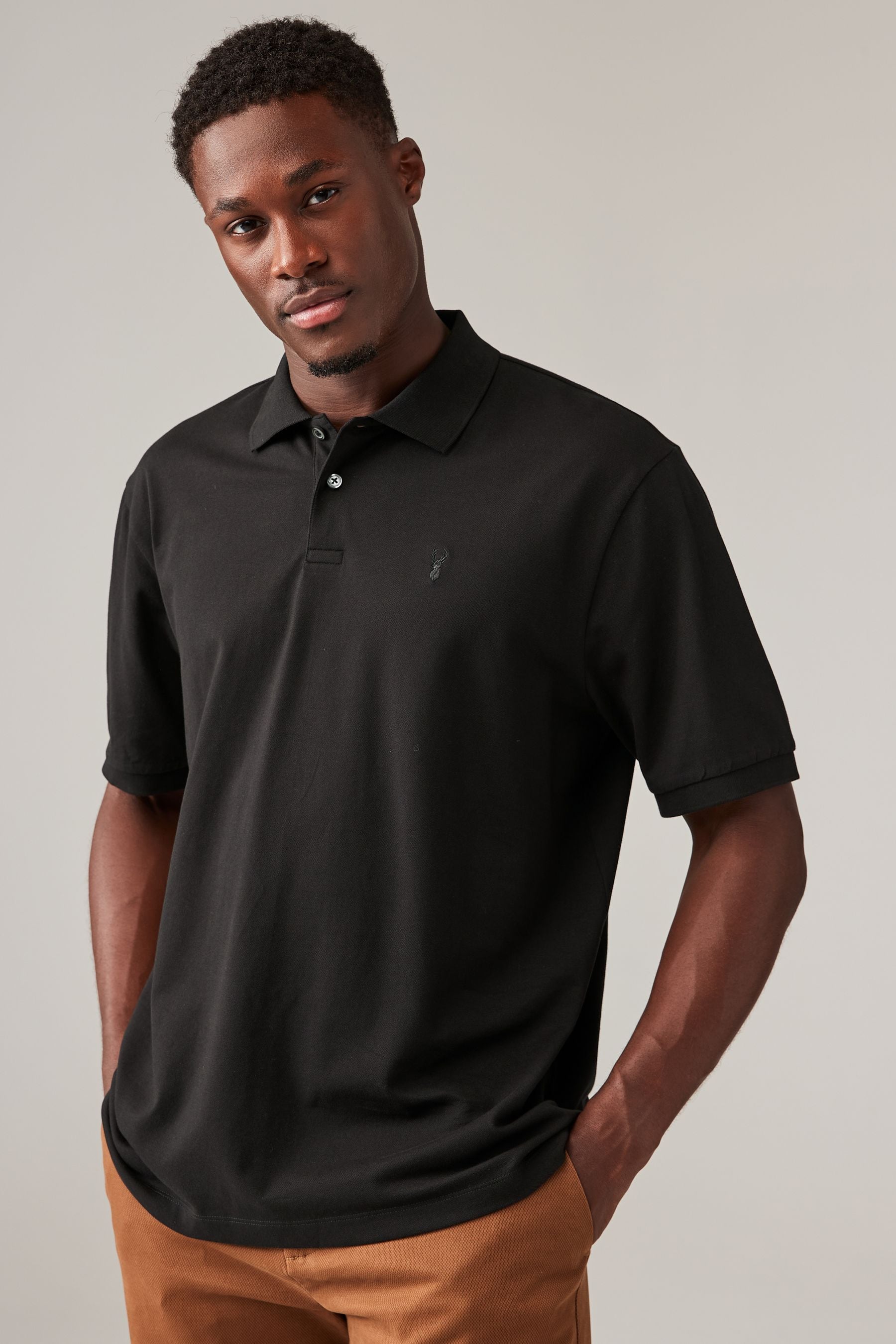 Black polo shirt next discount